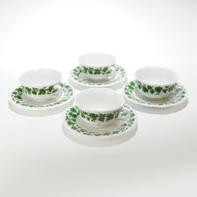 A Collection of Eight Meissen Full Green Vine Pattern Cup and Saucer Sets