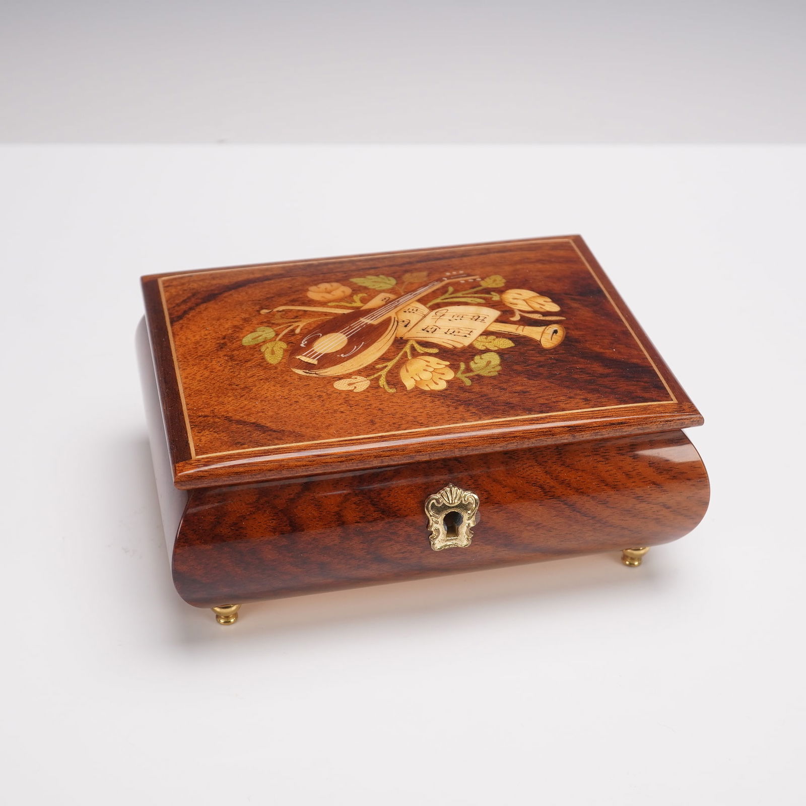 Sanyo Italian Marquetry Inlaid Wood Music Jewelry Box: Finely crafted Italian wooden music jewelry box with intricate marquetry inlay on the lid depicting a lute, scroll, and floral motif. The box features a polished finish with a hinged lid opening to a