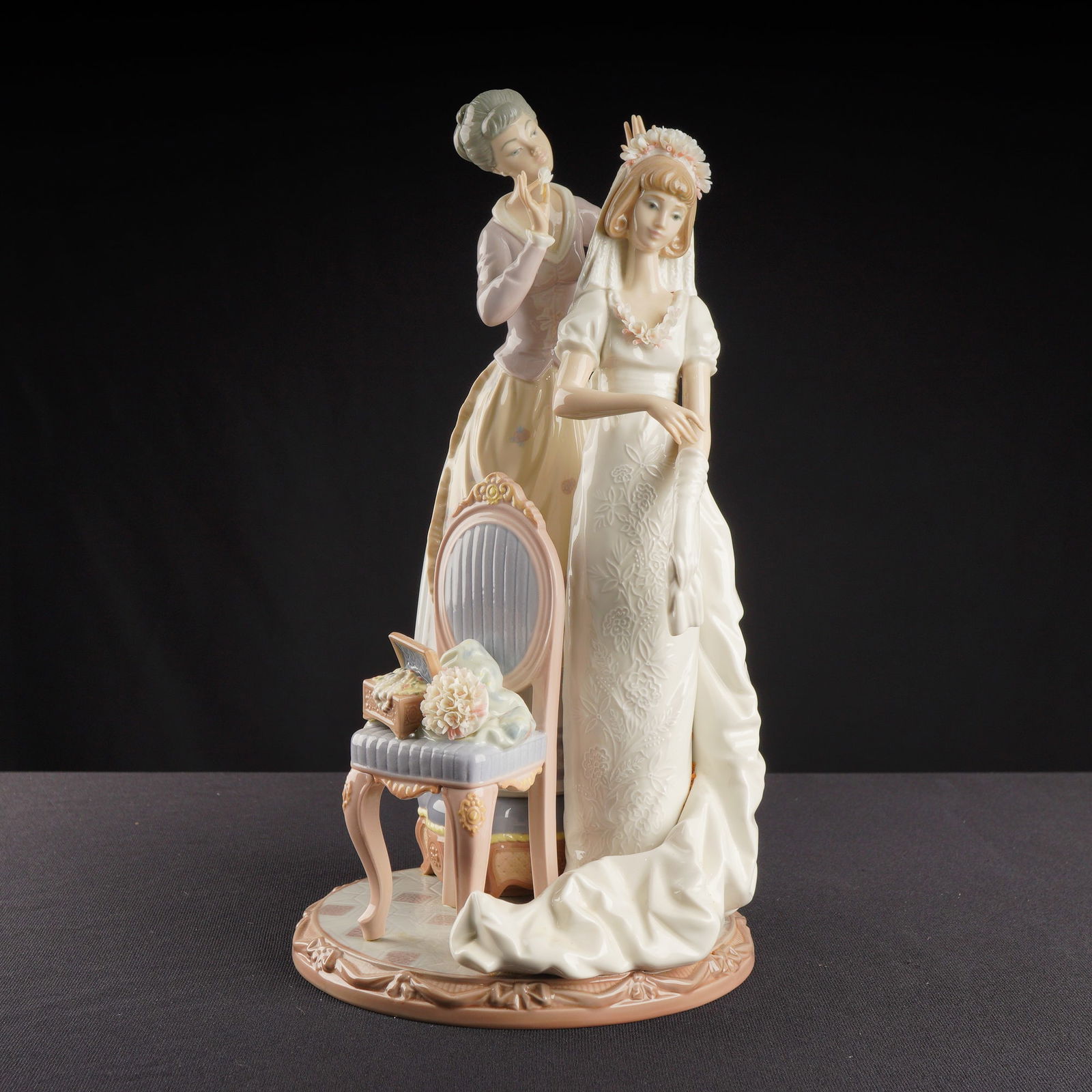 Lladro Porcelain Sculpture My Wedding Day Figurine 01001494: A Lladro Porcelain Sculpture titled My Wedding Day, model number 01001494, created in 1985. This composite glazed figurine group, Hand Made in Spain, depicts a sentimental genre scene featuring two wo