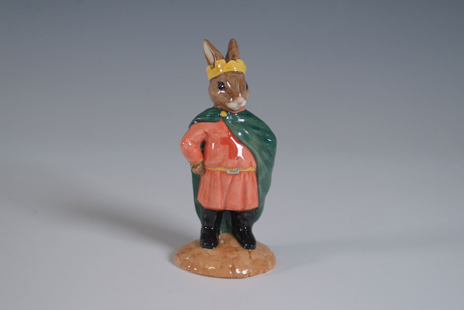 Royal Doulton Bunnykins Figurine, Prince John DB266: Royal Doulton Bunnykins figurine titled Prince John, model DB266, from the Robin Hood Collection. This hand-made and hand-decorated fine bone china figurine depicts Prince John in a regal pose, wearin