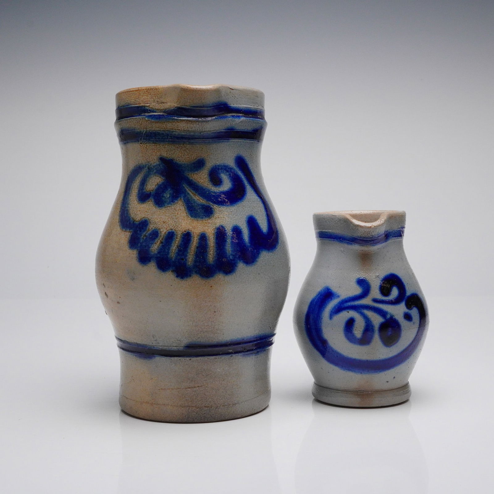 A Pair of German Westerwald Style Salt-Glazed Stoneware Pitchers (1 of 4)