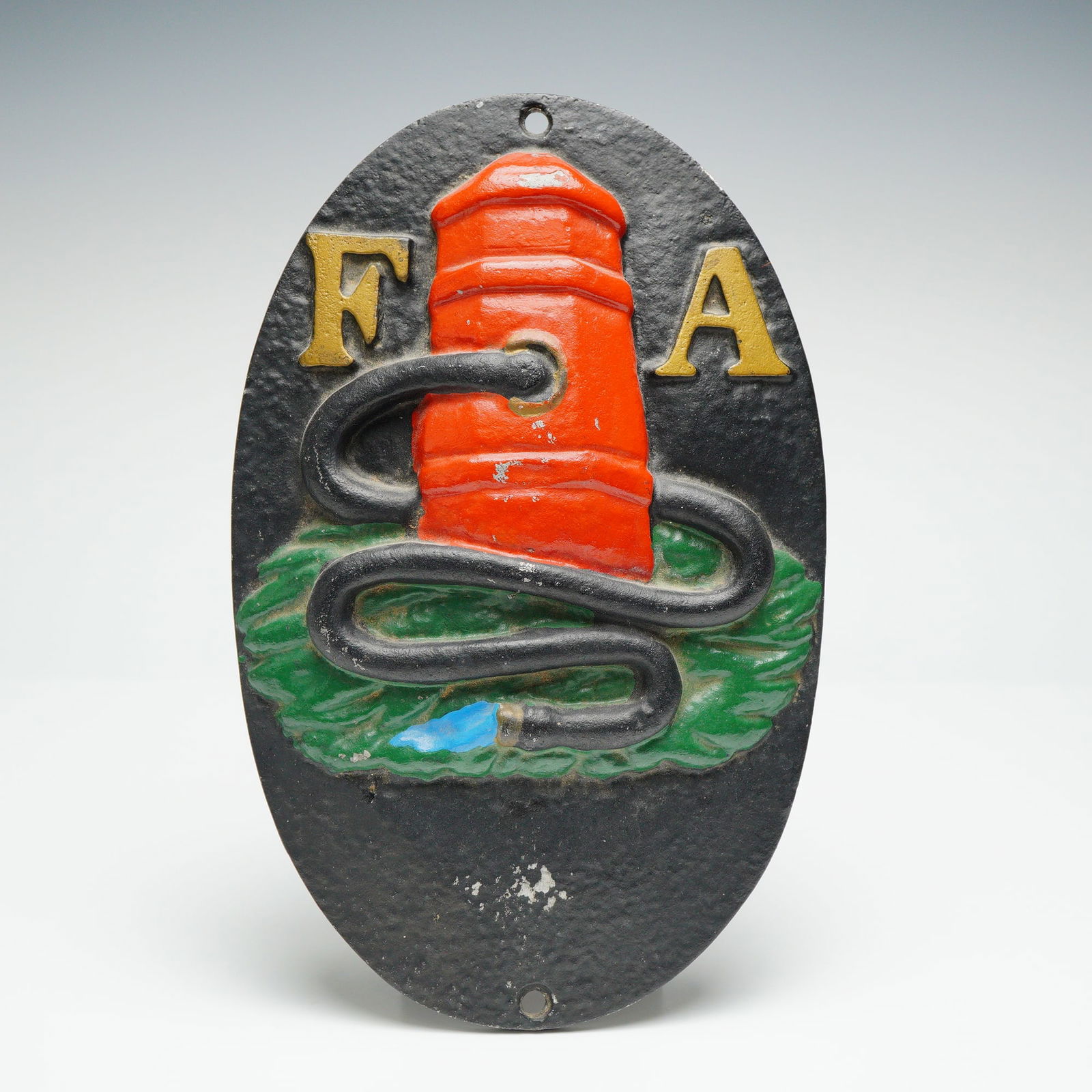 Fire Association of Philadelphia Cast Metal Fire Mark Plaque: This cast metal wall plaque represents the historic Fire Association of Philadelphia and is a later fire mark style piece modeled after the nineteenth century insurance marks issued by the company.