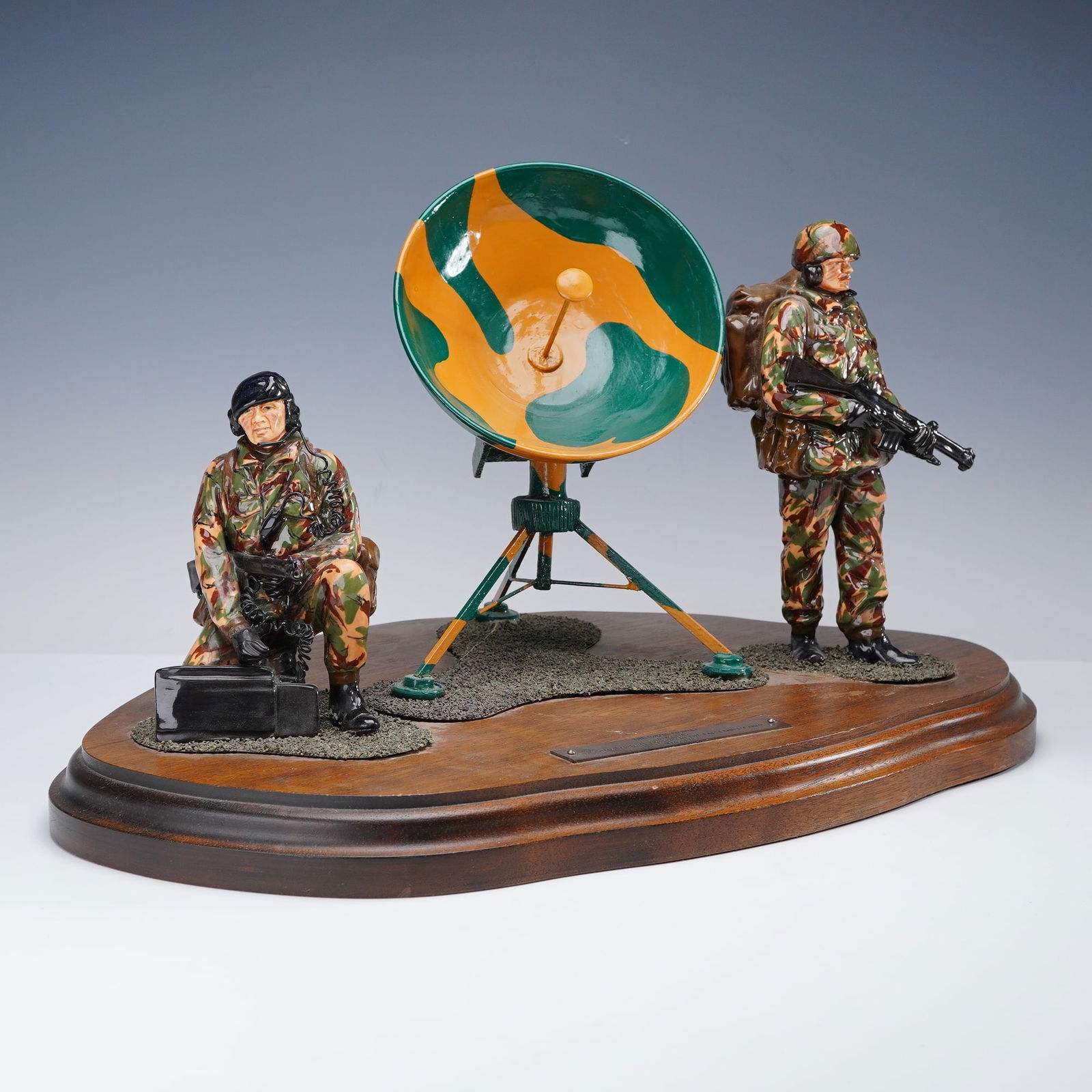 Michael Sutty Commemorative Tableau Sculpture, Royal Signals - Ajax Bay: Limited edition porcelain military sculpture honors the Royal Signals at Ajax Bay, created to commemorate the British victory in the Falkland Islands in May 1982. Presented on a shaped wooden base,