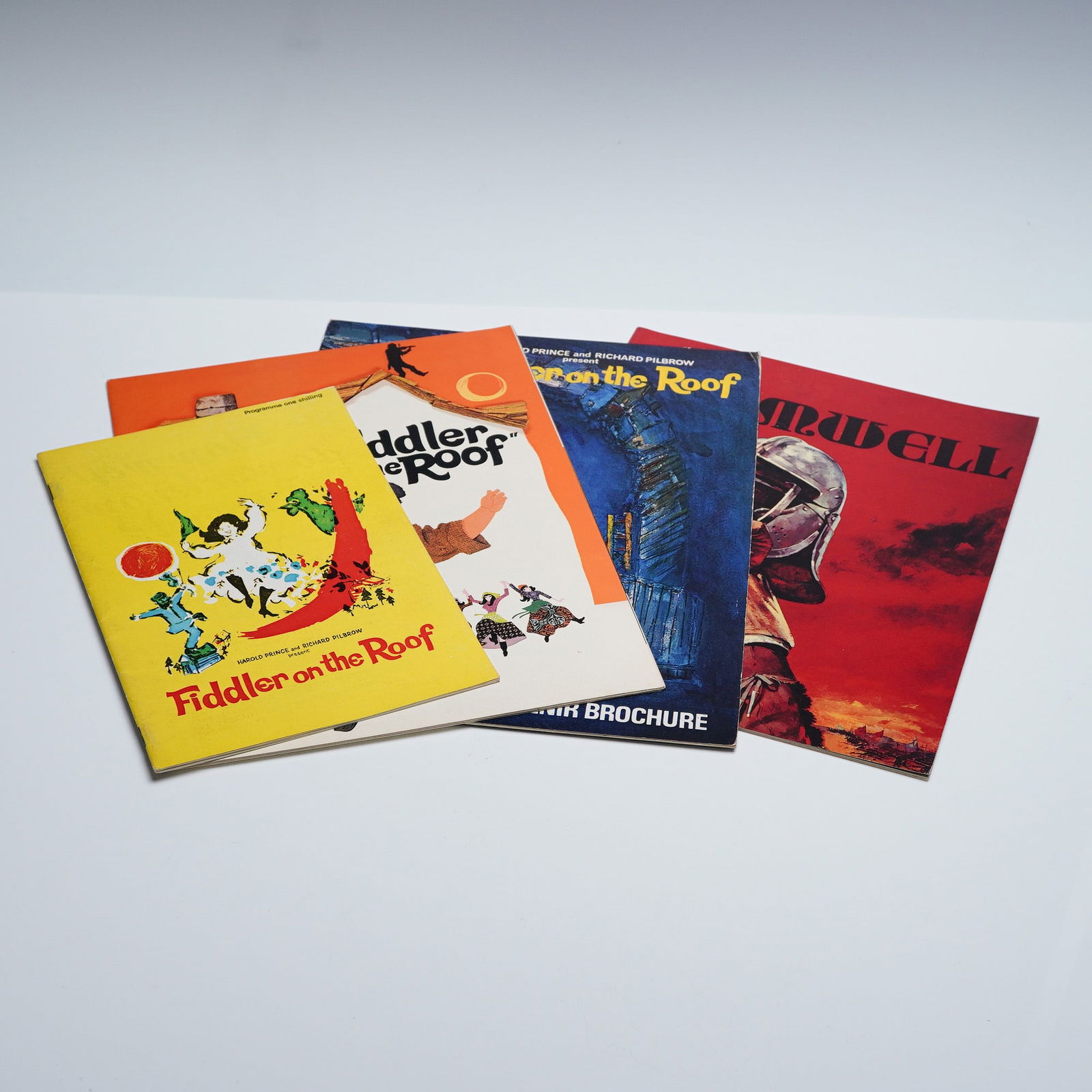 4pc Theatre & Film Brochures Cromwell, Fiddler on the Roof, More: This lot includes four theatre and film brochures, including Cromwell with vibrant cover art, Fiddler on the Roof featuring Topol in the lead, and other vintage programs. These materials highlight ico