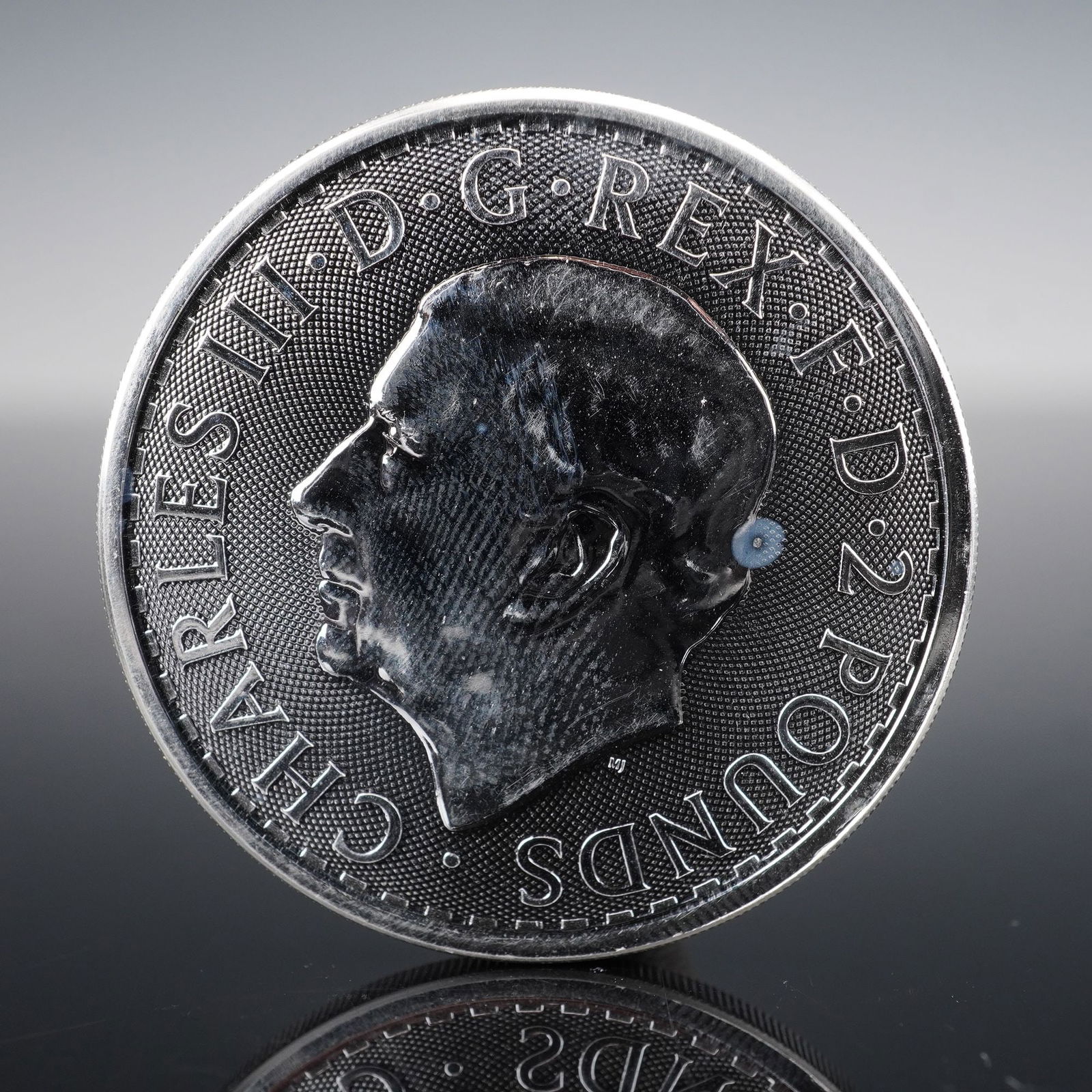 2023 Great Britain Silver Britannia 2 Pound Coin, King Charles III: This stunning 2023 Great Britain Silver Britannia coin features the first official effigy of King Charles III on the obverse, and the timeless image of Britannia on the reverse, standing proud with