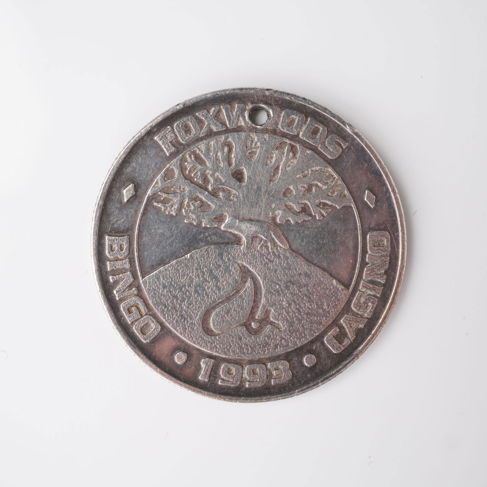1993 Foxwoods Casino American Wildlife Series .999 Fine Silver Token: Struck in .999 fine silver, this 1993 Foxwoods Casino token from the American Wildlife Series features two rearing horses on the reverse, surrounded by the inscription AMERICAN WILDLIFE SERIES .999