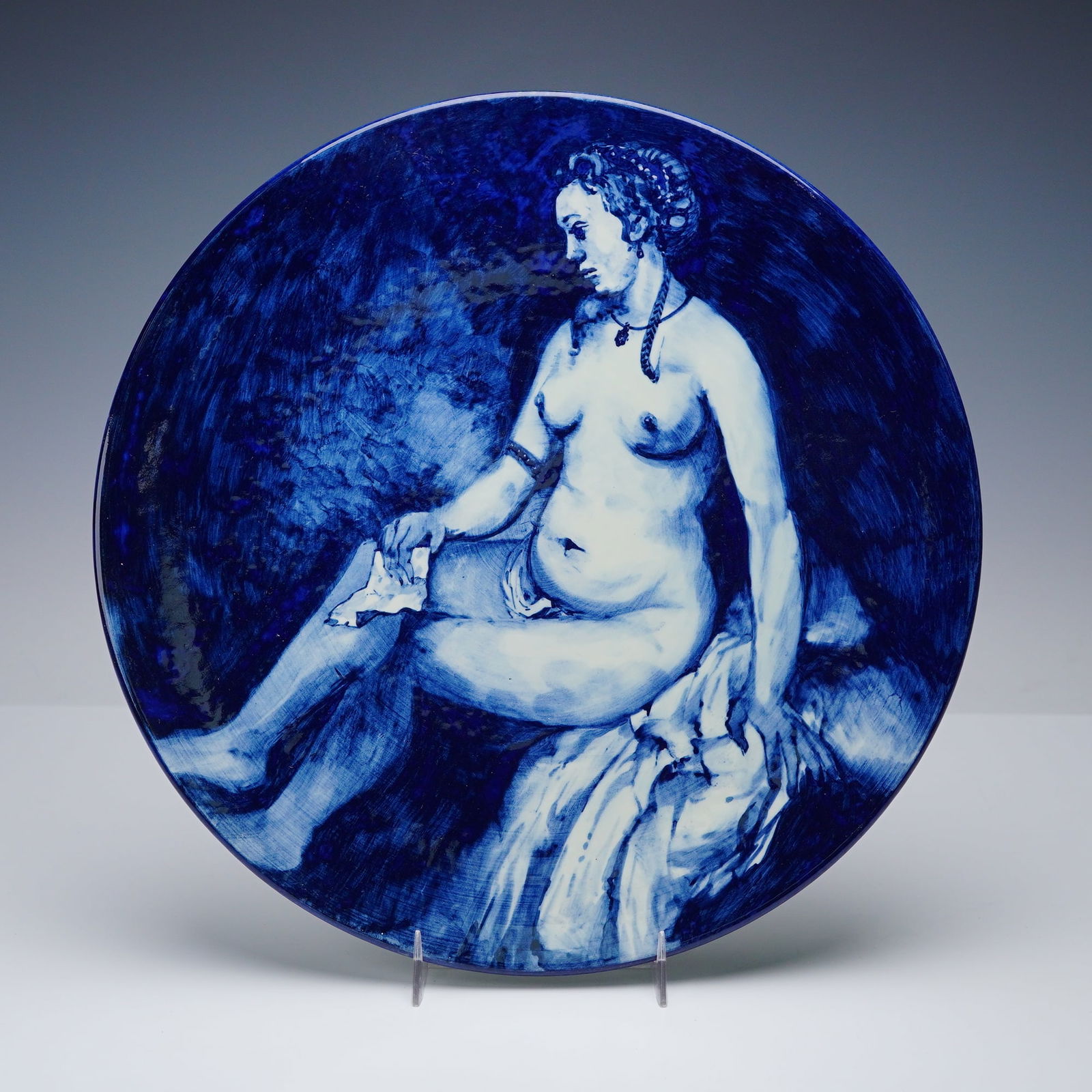 After Rembrandt Delft Hand Painted Decorative Porcelain Plate: This Delft hand painted porcelain decorative plate features a detailed blue and white scene rendered after Rembrandt, executed in rich cobalt tones with expressive brushwork. The reverse is marked DP