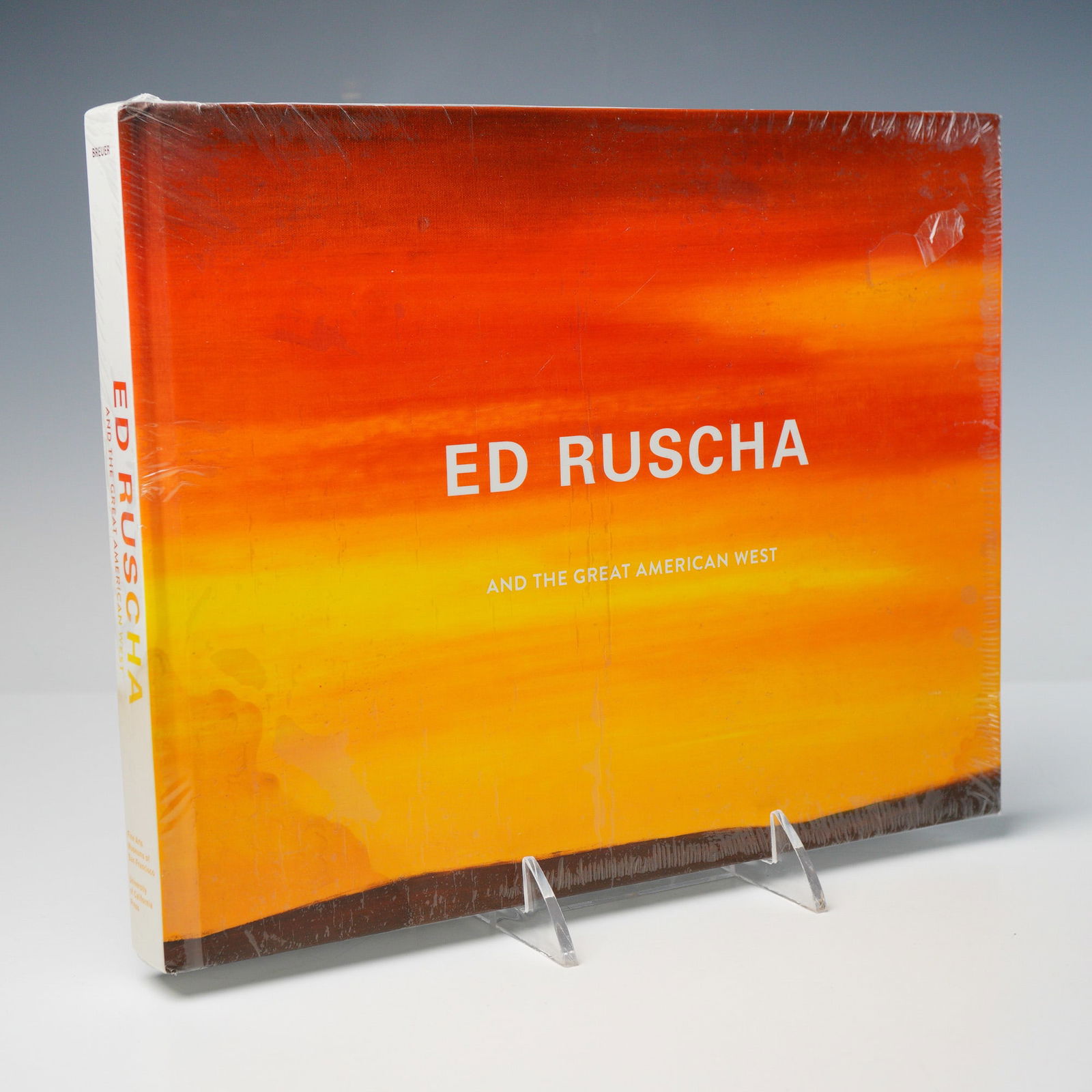 Editor Karin Breuer Hardcover Book, Ed Ruscha: And The Great American West: A sealed art book and exhibition catalogue that explores the life, work, and artistic vision of Ed Ruscha (American, b. 1937) through the lens of the American West, both as a physical place and a
