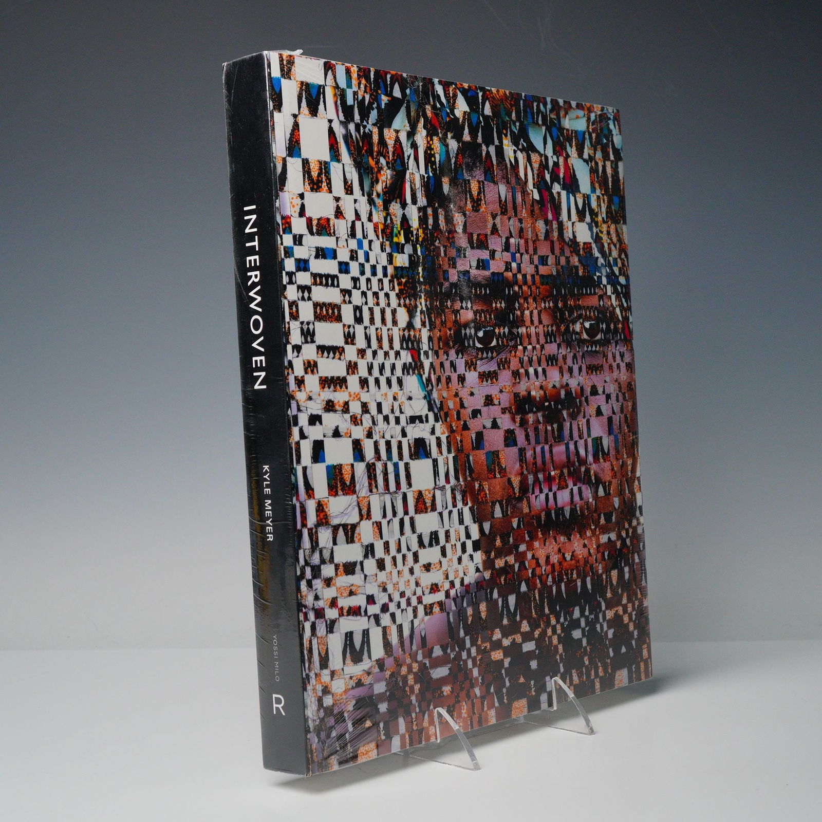 Kyle Meyer Hardcover Book, Interwoven: A sealed art book and debut monograph by photographer and artist Kyle Meyer (American, b. 1985). It collects work from his Interwoven series, which blends digital photography with traditional Swazi