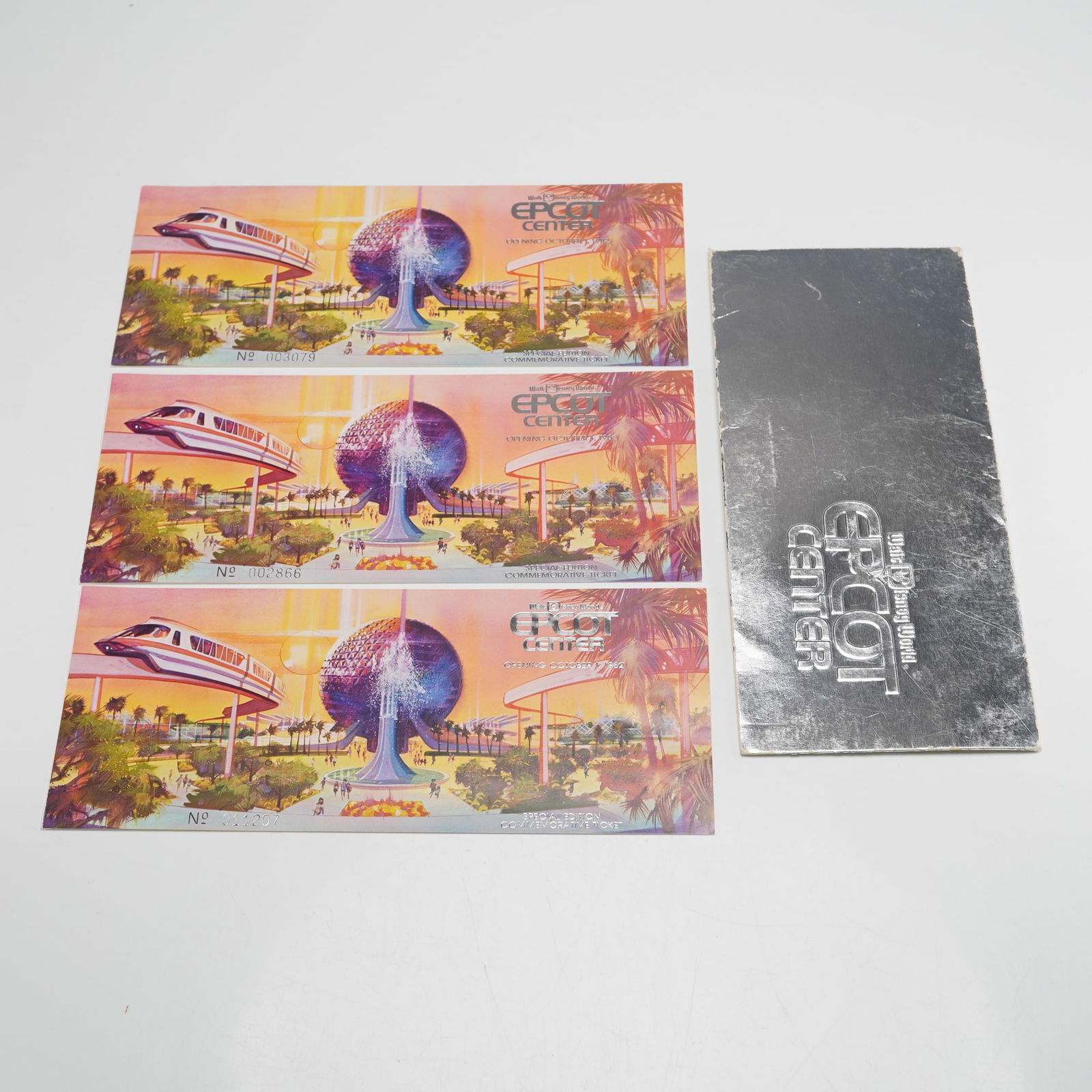 Three Disney EPCOT 1982 Opening Day Commemorative Tickets: Set of three EPCOT Center 1982 Opening Day commemorative tickets with colorful illustration of Spaceship Earth and monorail. Text includes EPCOT CENTER, OPENING OCTOBER 1, 1982, SPECIAL EDITION