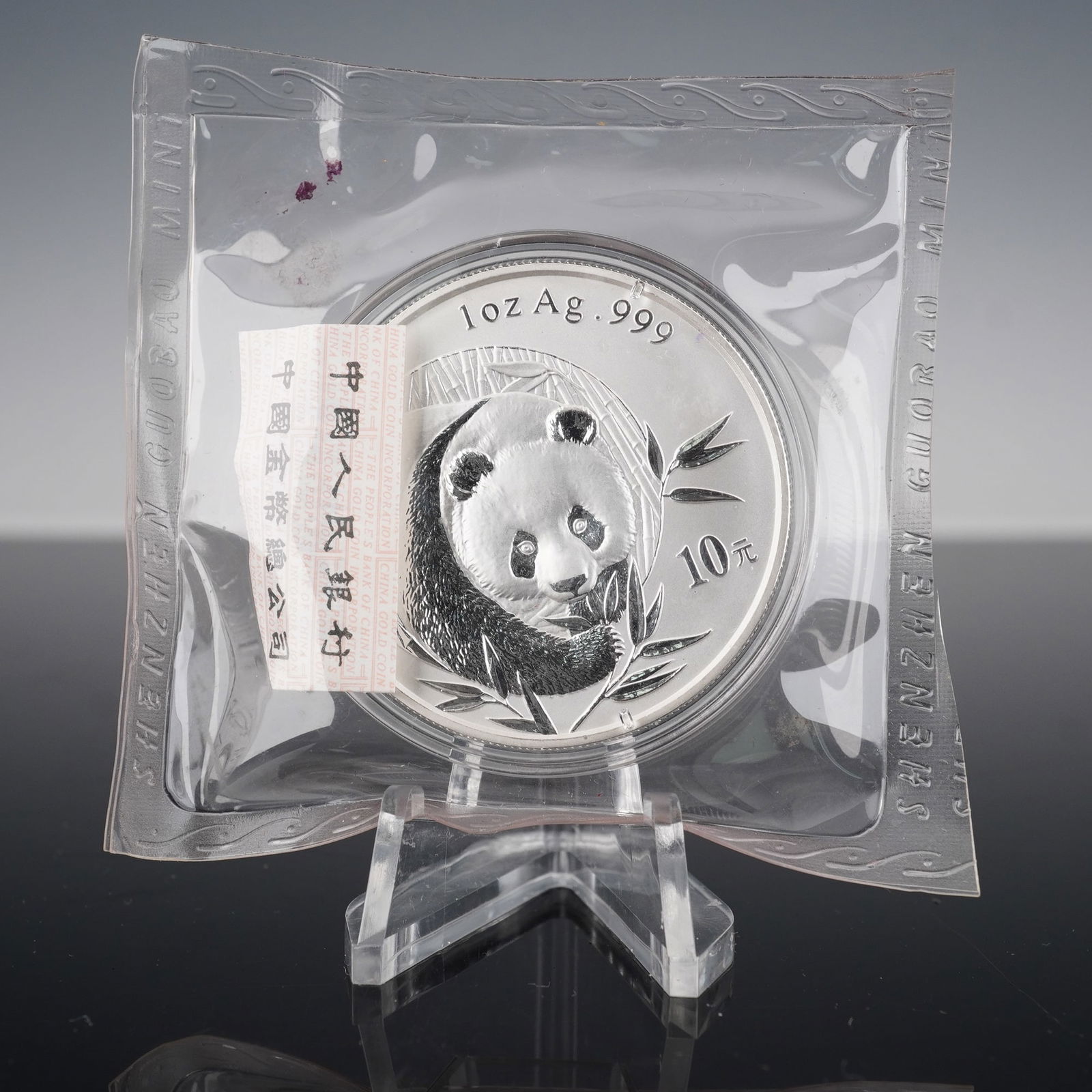 2003 Chinese Panda Bullion Coin 10Y 1oz Silver in Original Packaging: This 2003 Chinese Panda Bullion Coin features a beautiful design in 1oz .999 fine silver. The obverse showcases the Temple of Heaven with the inscription (People's Republic of China) and the year