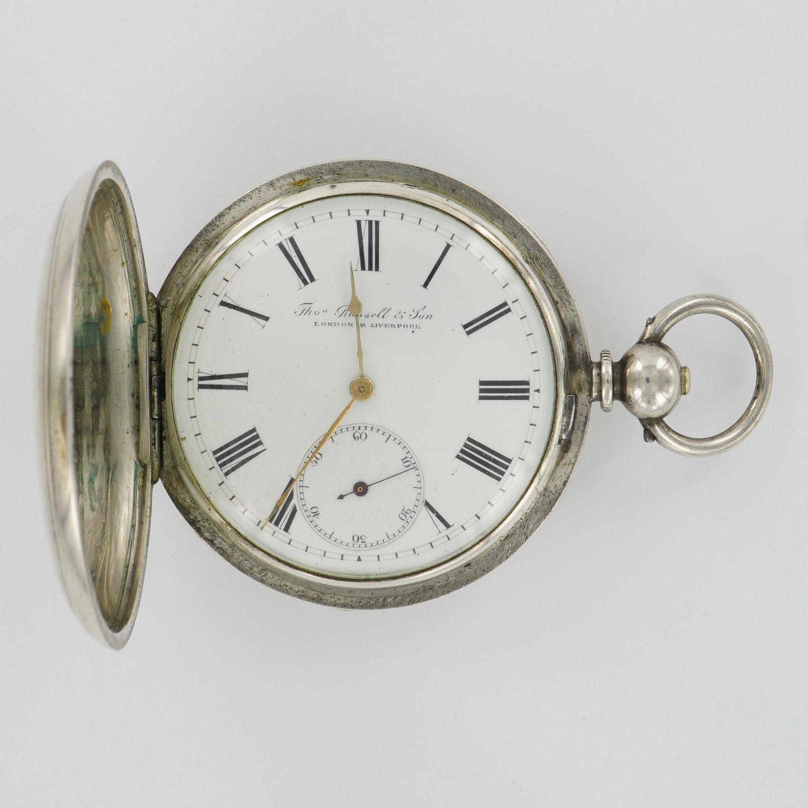 Thomas Russell & Son 18s KWKS Fine Silver Hunter Case Pocket Watch: Thomas Russell & Son 18s KWKS Fine Silver Pocket Watch with Key. The watch case is stamped "Fine Silver" and numbered 79010. The dial features Roman numeral hour markers with a subsidiary seconds dial