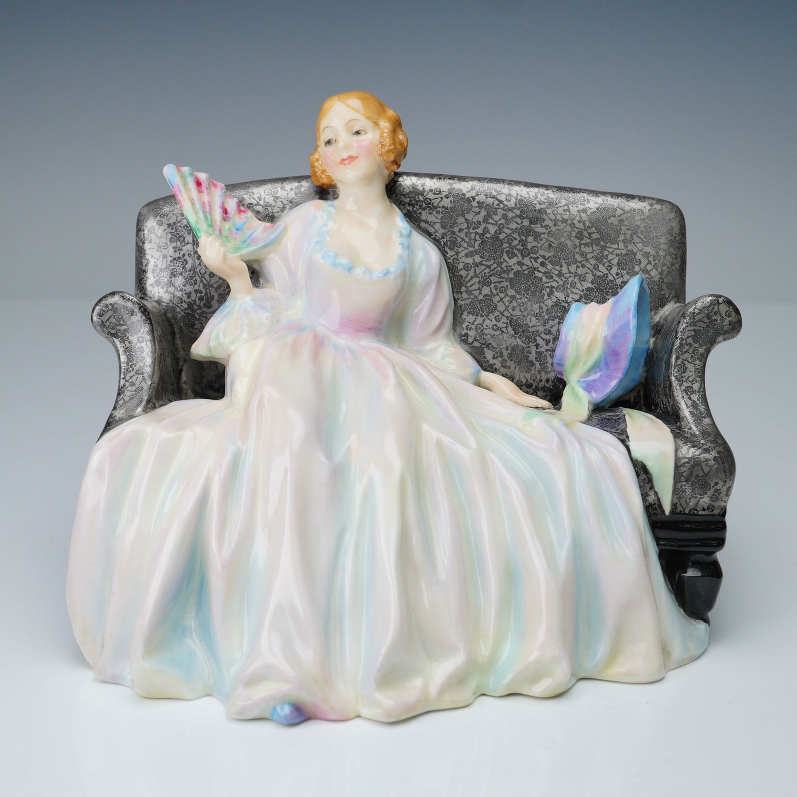Royal Doulton Colorway Figurine, Sweet and Twenty HN1360: Charming Royal Doulton figurine titled Sweet and Twenty, model HN1360, designed by Leslie Harradine and produced by Royal Doulton in England. This hand-painted figure portrays a young woman with golde