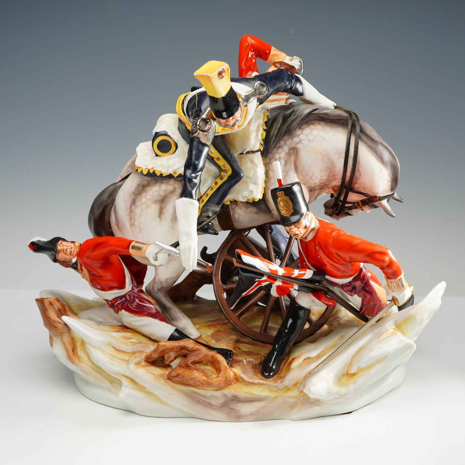 Michael Sutty Porcelain Figurine, The Buffs: A porcelain tableau depicting a dramatic moment from English military history. Inspired by the Battle of Albuera (16 May 1811), it portrays Ensign Edward Thomas and Lieutenant Matthew Latham's valiant