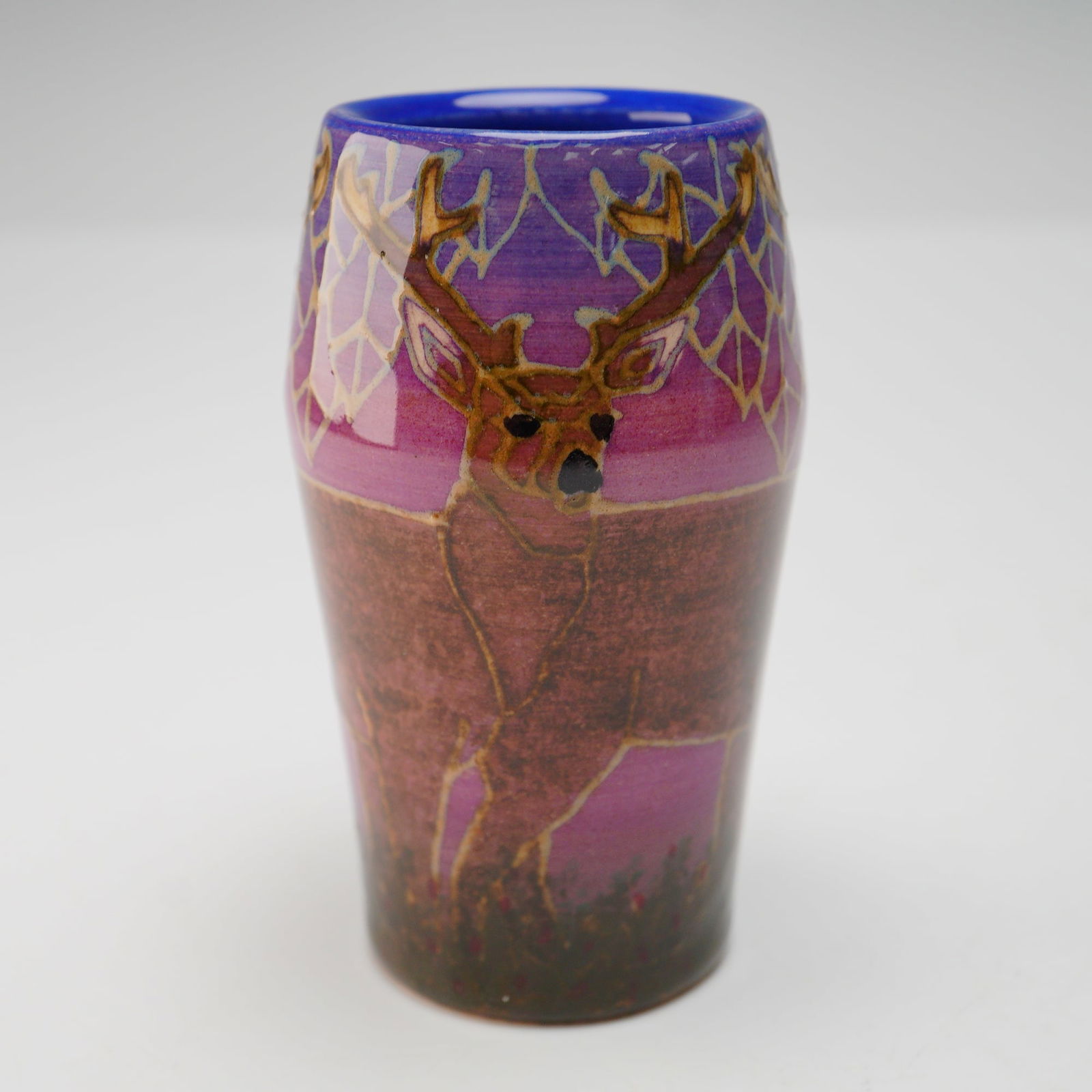 Dennis Chinaworks Pottery by Sally Tuffin Mini Deer Vase: This handcrafted piece features a stylized deer motif rendered in a decorative Art Deco-inspired pattern, with rich glaze coloration and bold contouring typical of Chinaworks' studio production. The v