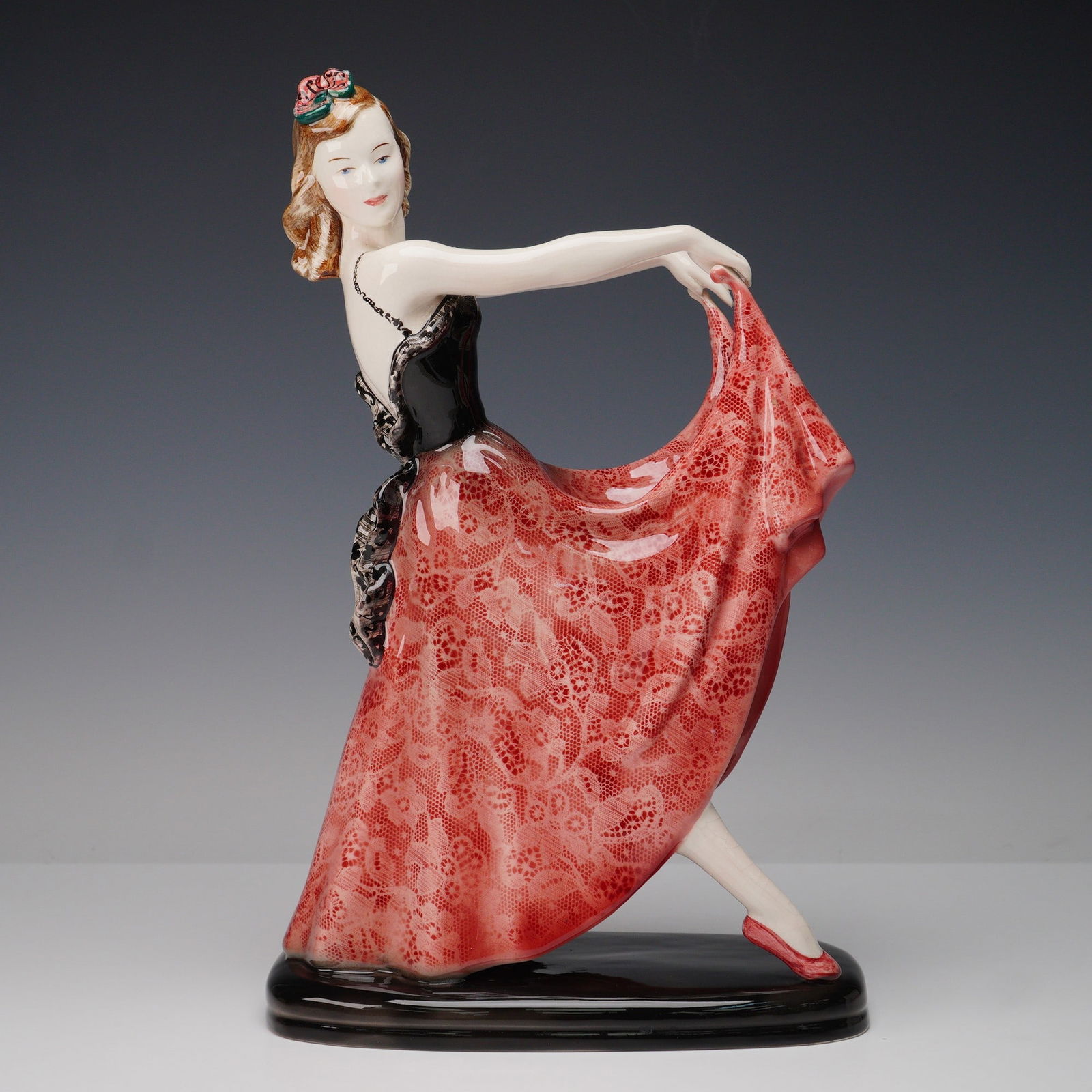 Goldscheider Parisienne by Helen Liedloff Dancing Girl Figurine: Porcelain figurine produced by Goldscheider U.S.A. as part of the Parisienne series, designed by Helen Liedloff. The piece depicts a young dancer posed mid-performance, holding her flowing skirt out