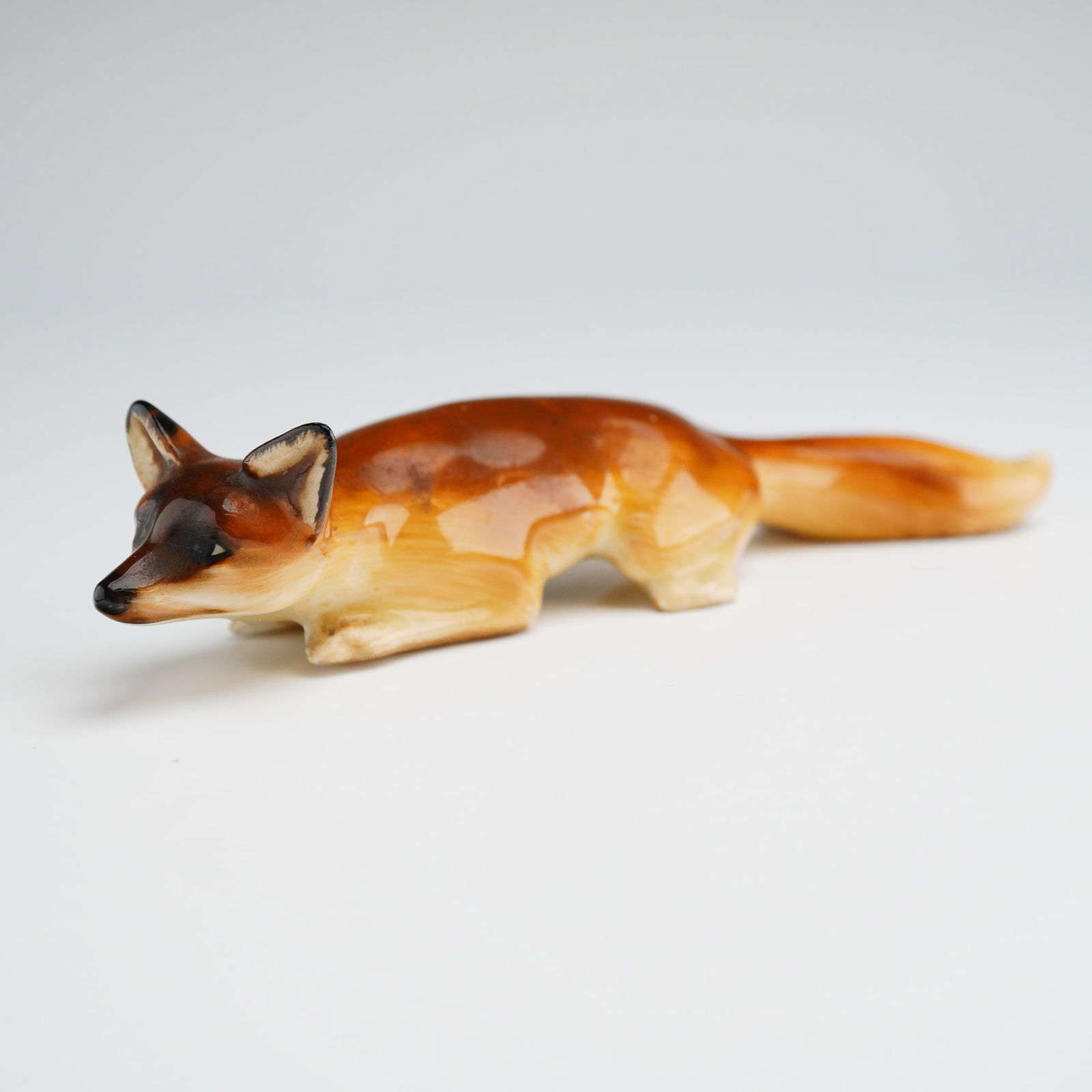 A Royal Doulton Glazed Ceramic Figurine of a Crouching Fox HN 147 (1 of 4)