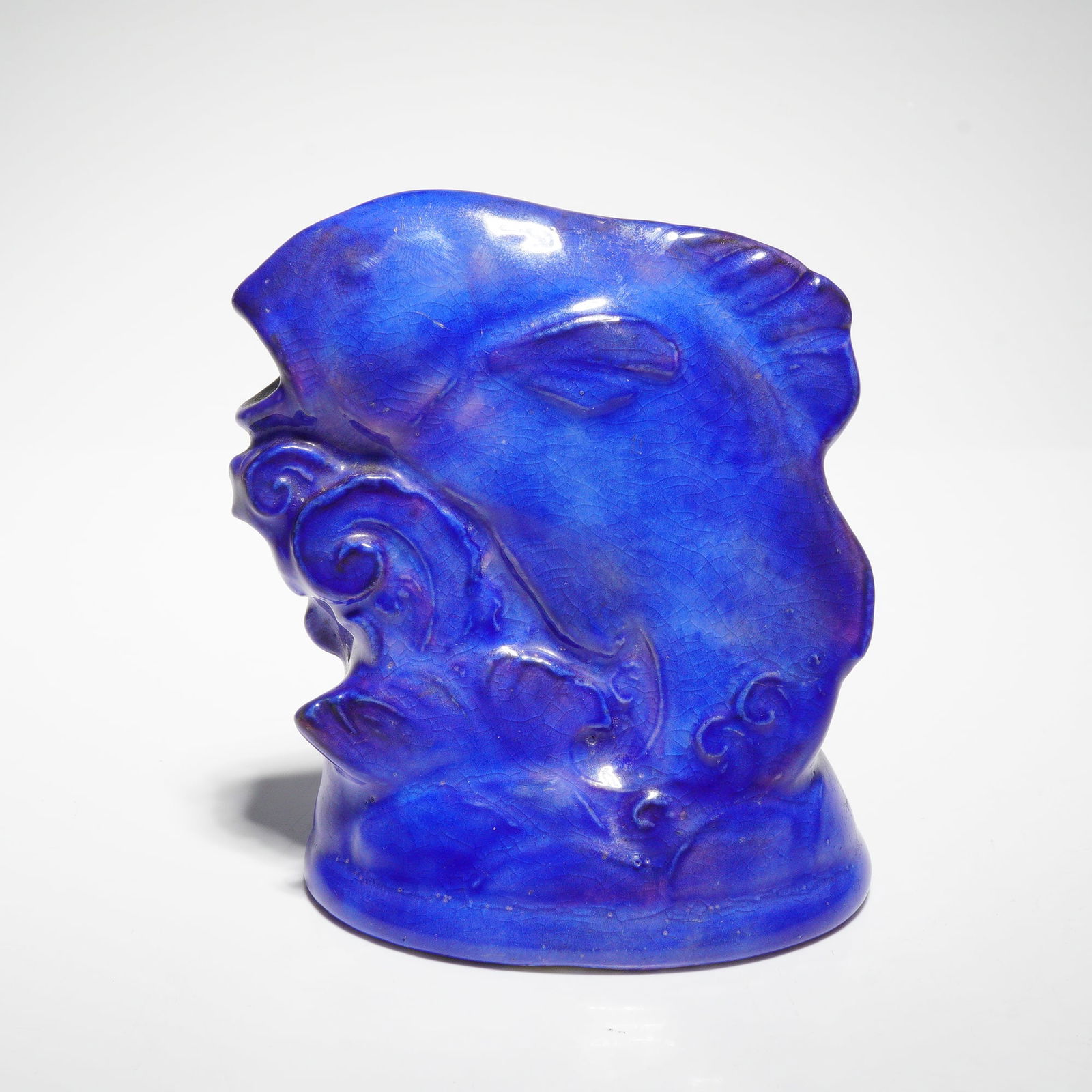 Extremely Rare Unrecorded Royal Doulton Lapis Lazuli Glaze Fish Figurine: Featuring a solitary fish rising from molded, swirling waves and finished in a blue lapis-lazuli glaze. This figure appears to be an undocumented form, absent from standard Royal Doulton production re