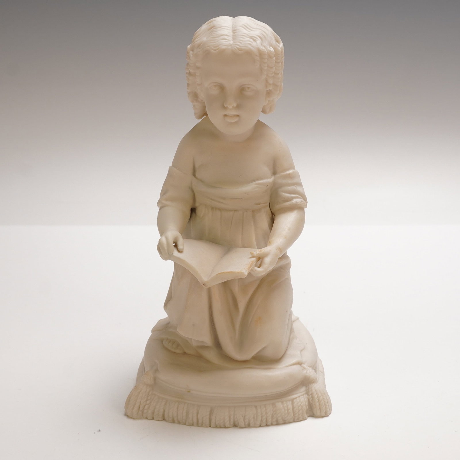 Parian Figure of a Seated Girl Reading, No. 178 (1 of 4)