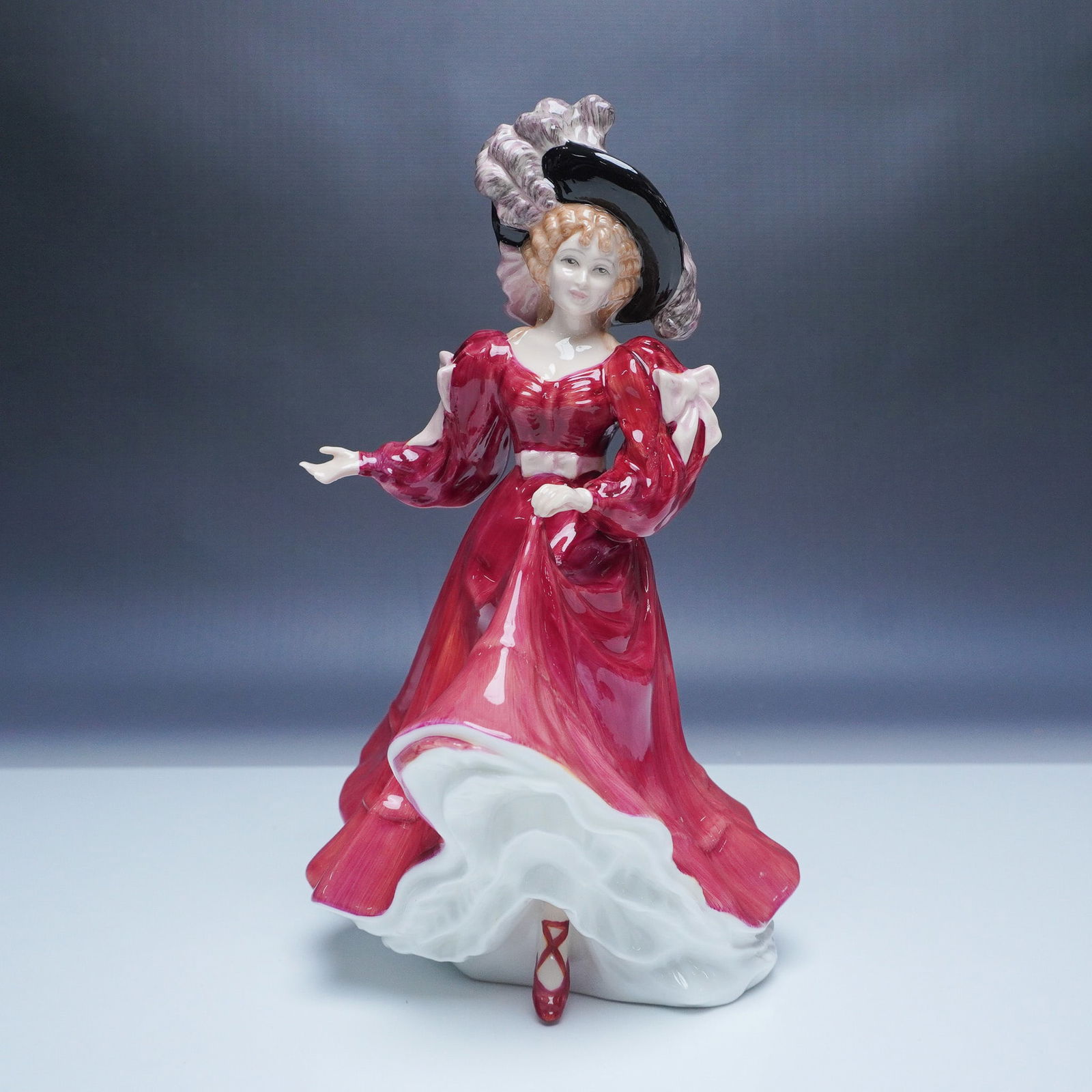 Royal Doulton Figure of the Year 1993 Patricia HN 3365: A striking Royal Doulton figurine titled Patricia, model number HN 3365, released as the 1993 Figure of the Year. Designed by renowned sculptor Valerie Annand, this elegant bone china figurine feature