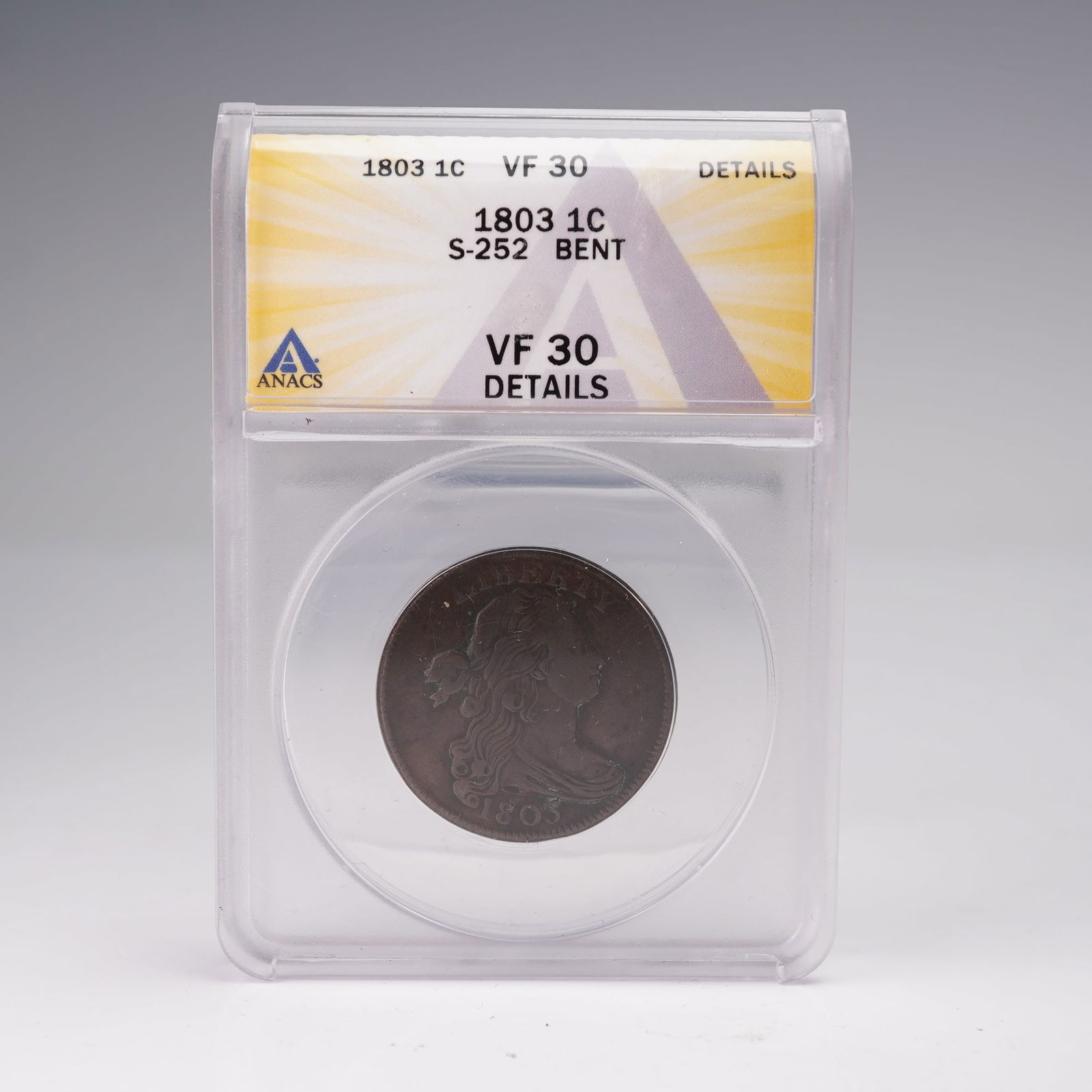 1803 Draped Bust Large Cent S-252 ANACS Graded VF 30 Details: This 1803 Draped Bust Large Cent, attributed as Sheldon-252, has been certified by ANACS as VF 30 Details with a note of bending. Designed by Robert Scot, the obverse features the classic Draped Bust