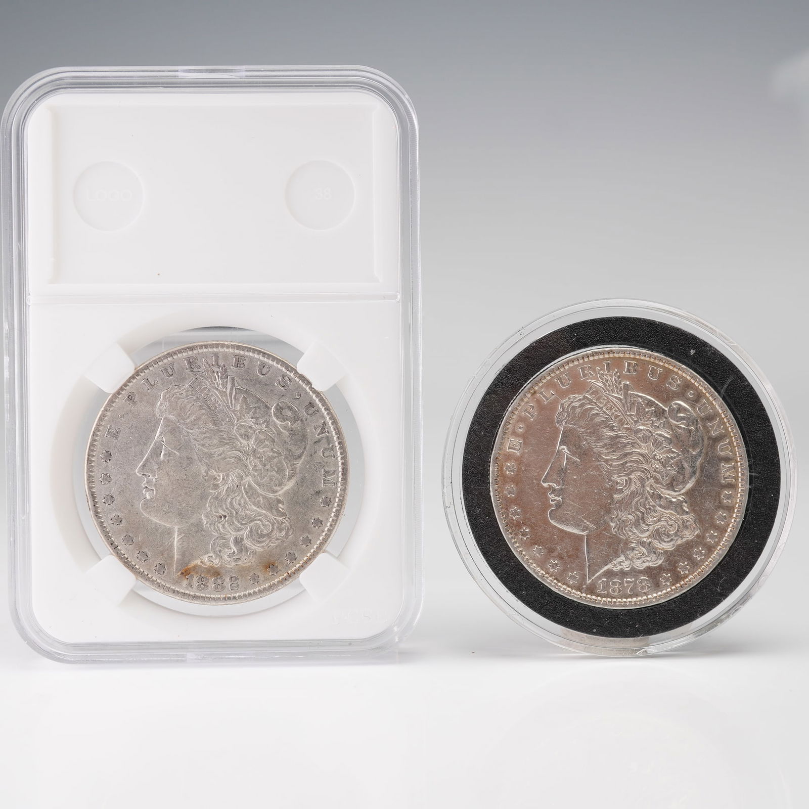 2pc 1878 Morgan Silver Dollar 7 Tail Feathers Reverse plus 1882 Morgan (1 of 2)