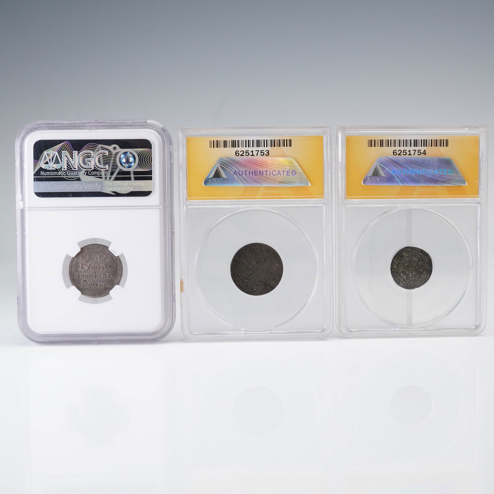 3pc Hungarian & German ANACS & NGC Graded Coins: A ANACS-graded AR denar of Hungary under Ladislaus I (1077-1095), featuring a cross-and-pellet motif on both sides with surrounding Latin inscriptions; an ANACS-graded AR denar of Hungary under Stepha