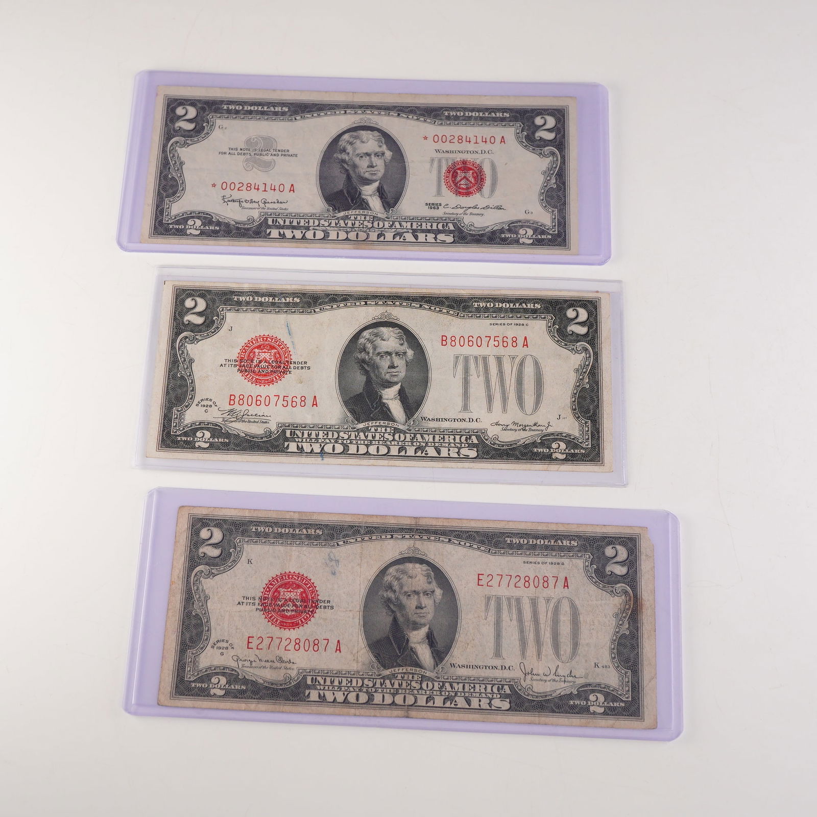 3pc 1928 C,G & 1963 U.S. Two Dollar Red Seal Notes Including Star Note (1 of 2)