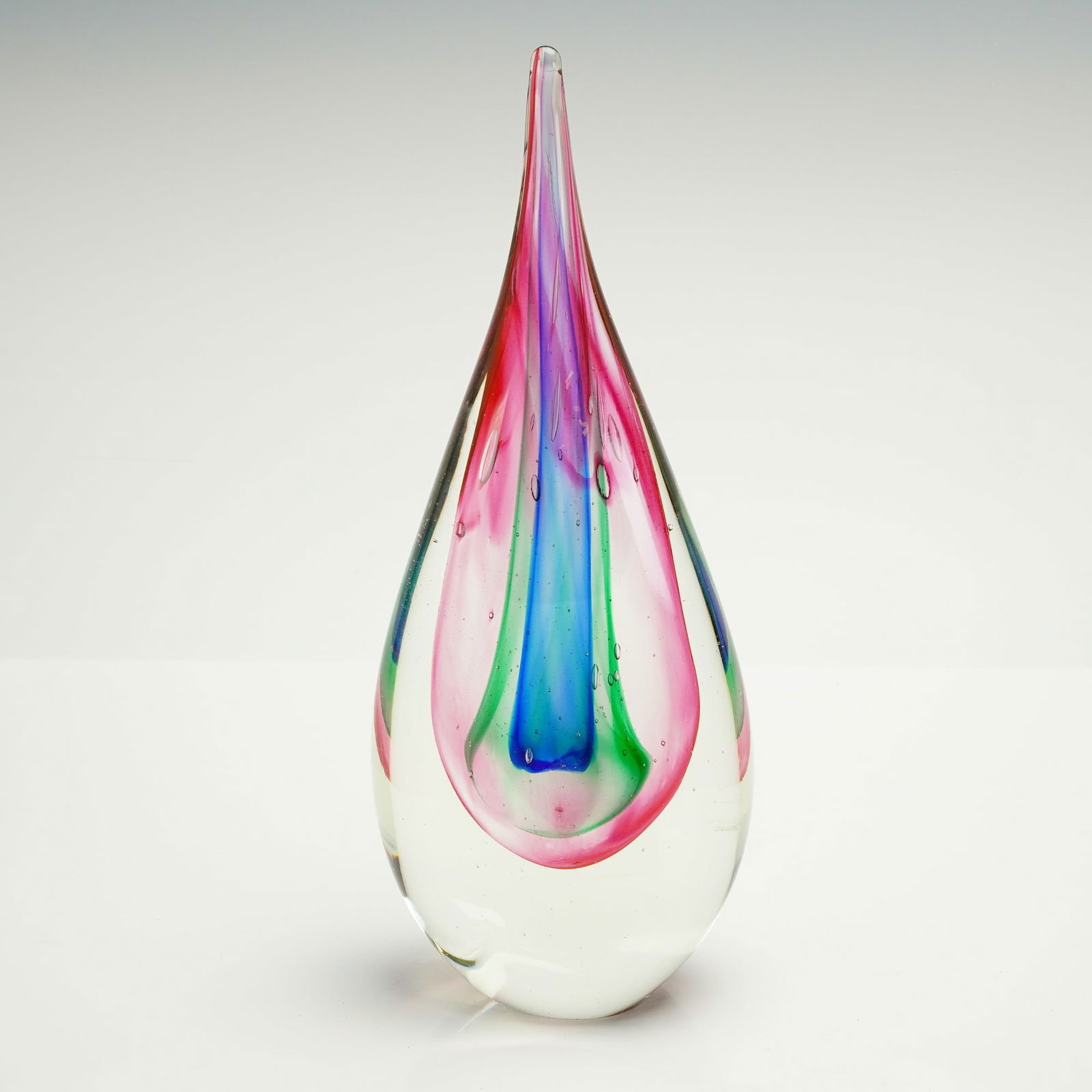 Murano Sommerso Teardrop Sculpture in the Manner of Flavio Poli: A single modern art glass sculpture executed in the Murano Sommerso technique, characterized by layered internal colors encased in thick clear glass. The form is a stylized teardrop or elongated flame