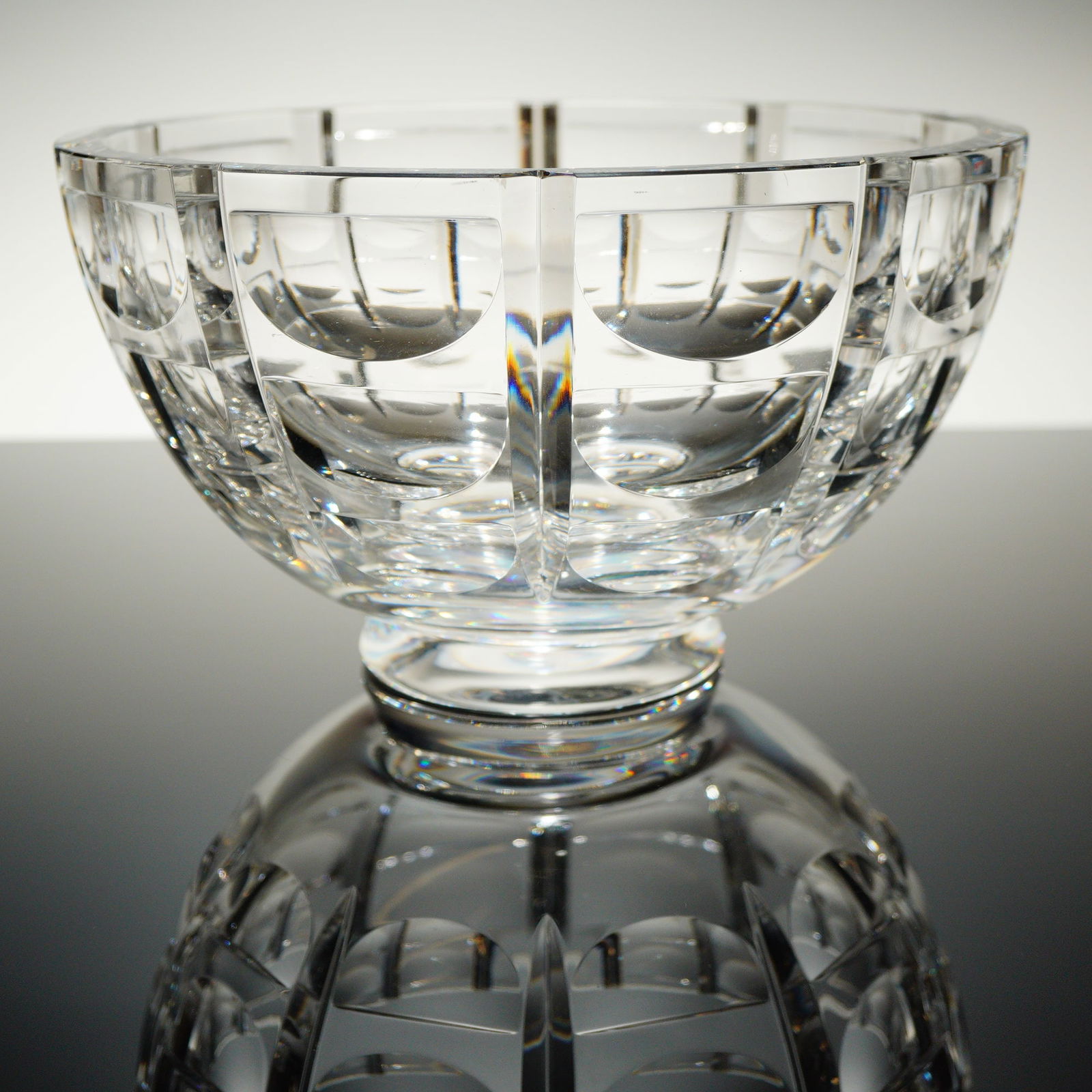 Orrefors Crystal Thousand Windows Footed Centerpiece Bowl by Simon Gate: A single, heavy, clear cut crystal centerpiece bowl executed in the Thousand Windows patern, designed by Simon Gate for Orrefors, Sweden. The bowl is constructed of thick, heavy crystal glass and feat