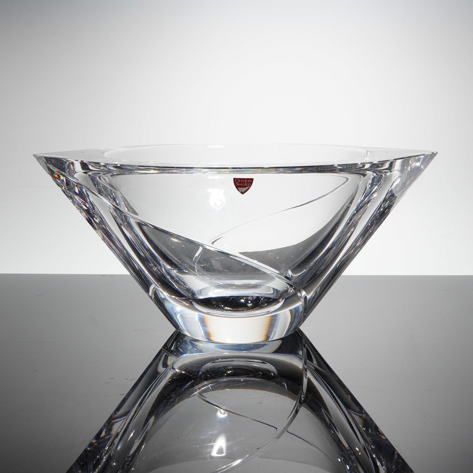 Orrefors Marin Swirl Crystal Bowl by Jan Johansson: A single heavy art glass bowl, identified as the Marin patern, designed by Jan Johansson for Orrefors Sweden. This Orrefors Crystal bowl is crafted from clear, thick crystal and executed in a Modernis