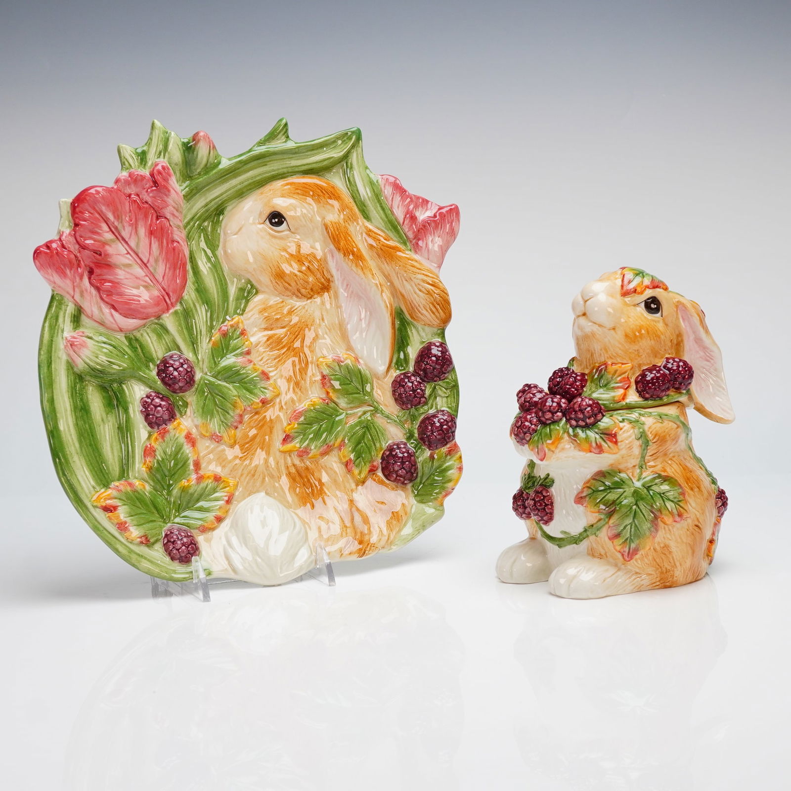 2pc Fitz and Floyd Blackberry Rabbit Lidded Jar and Canape Plate: A two-piece lot in the Fitz and Floyd "Blackberry Rabbit" pattern. The decoration is executed in high-relief and hand-painted details, featuring a rabbit nestled among glossy green leaves, deep maroon