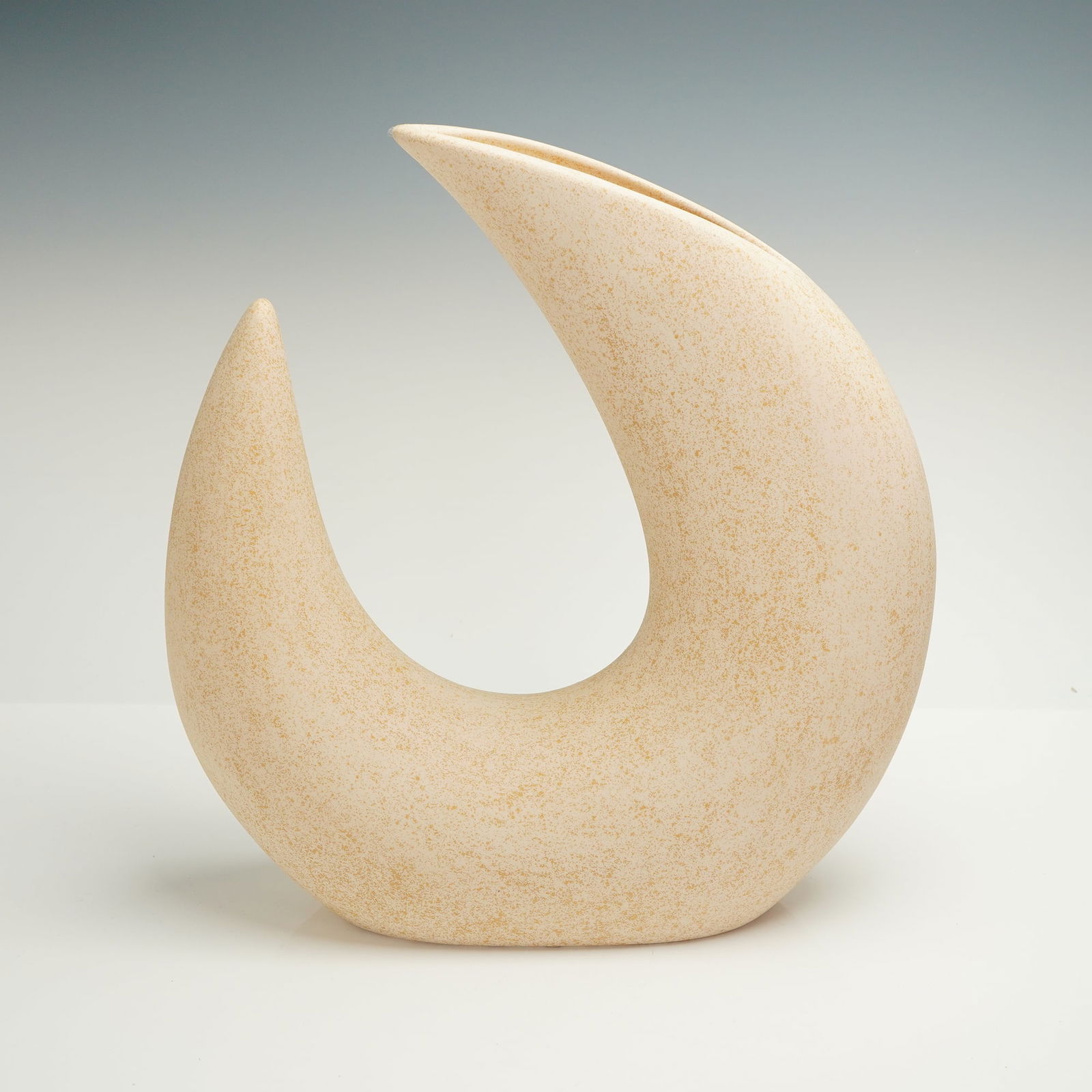 Avanti Ceramics Crescent Moon Vase: A single sculptural ceramic vessel manufactured by Avanti Ceramics of Tampa, Florida. The piece is designed in an abstract, curving crescent form strongly associated with Mid-Century Modern aesthetics
