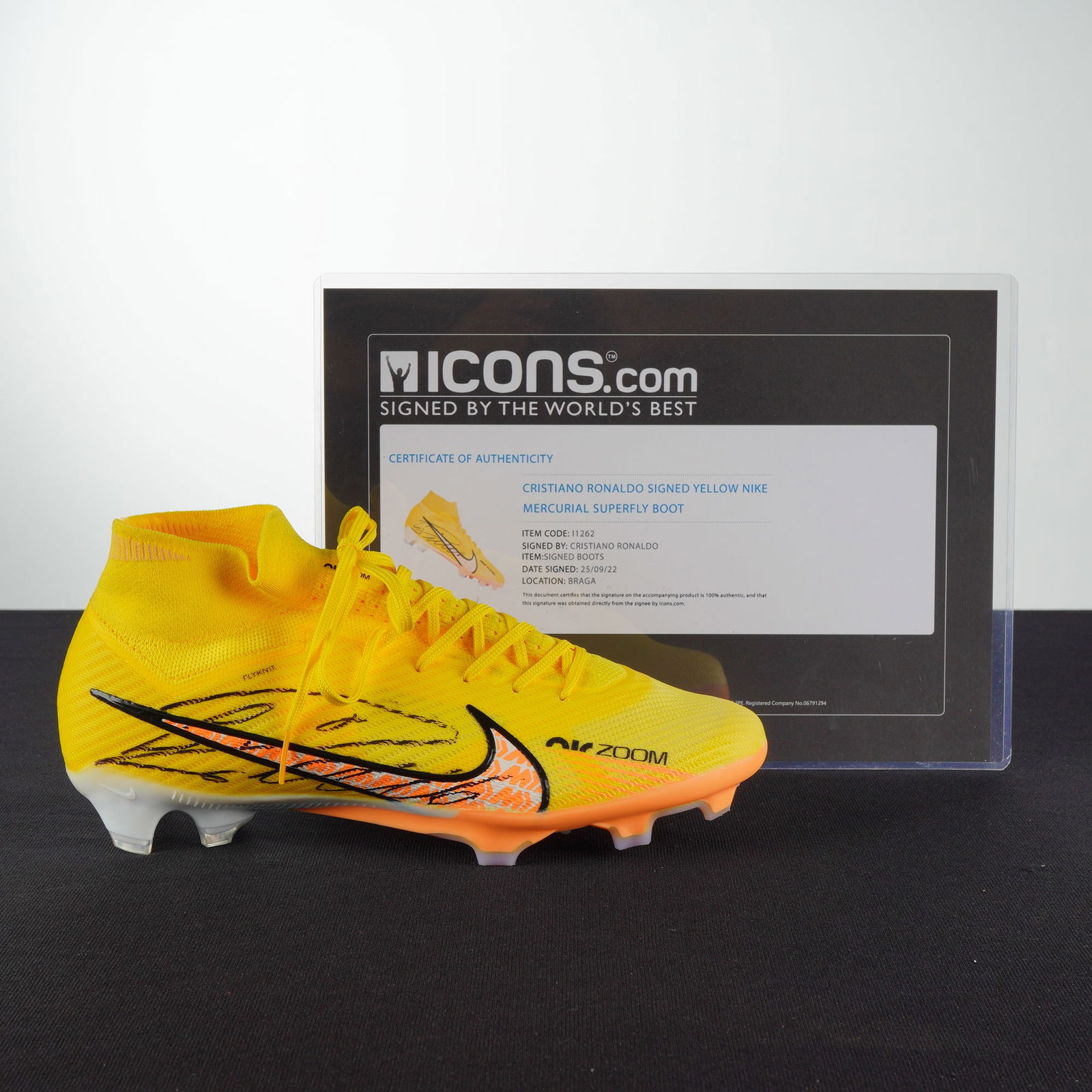 Cristiano Ronaldo Signed Yellow Nike Mercurial Superfly Boot with ICONS COA: A single signed football boot and its accompanying Certificate of Authenticity (COA) from Icons. The boot is identified through authentication as a Cristiano Ronaldo Signed Yellow Nike Mercurial Super
