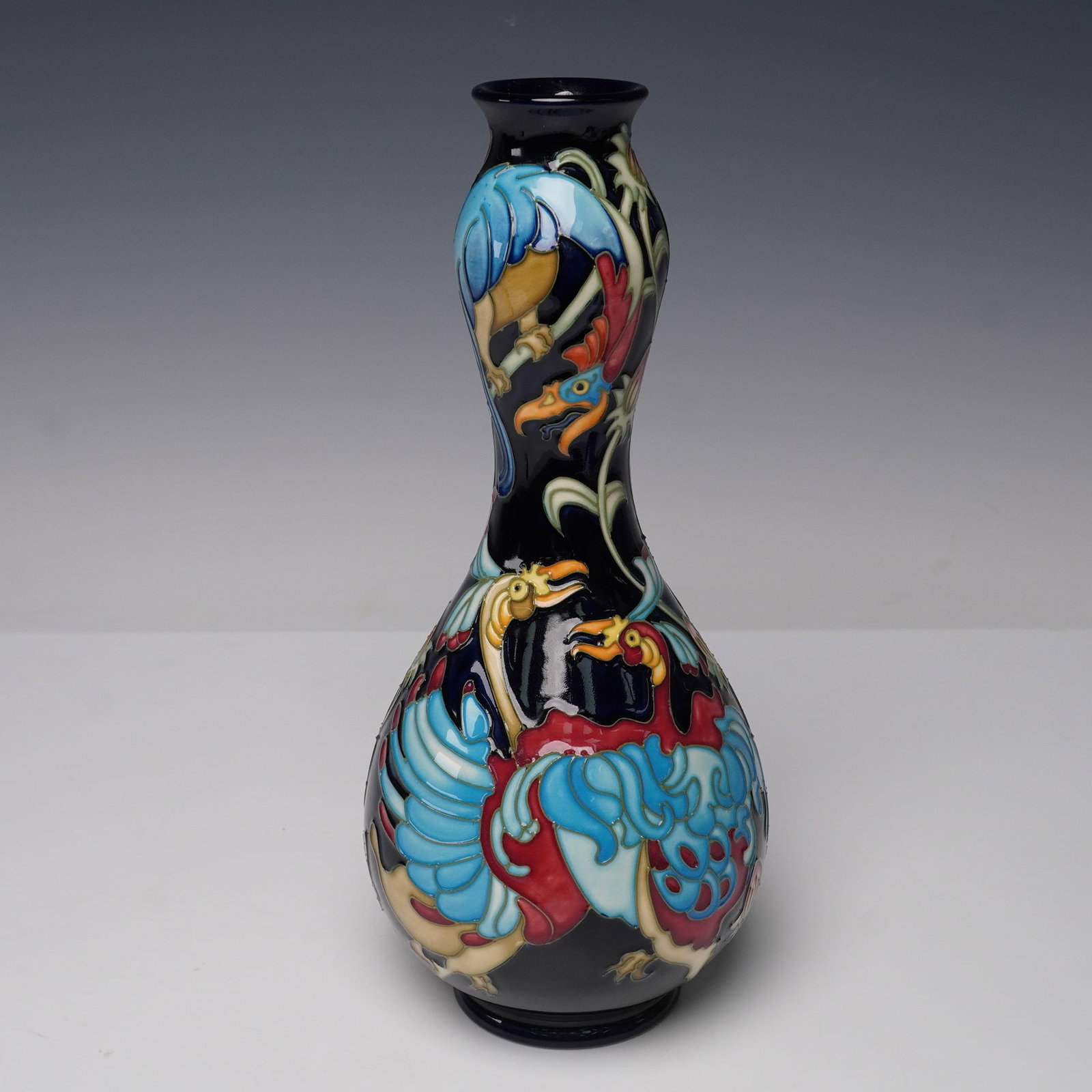 Moorcroft Pottery Limited Edition Chinese Lantern Vase: A striking Moorcroft Pottery vase designed by Nicole Slaney, produced in a limited edition of only 200 pieces. The design features brilliantly colored Chinese lantern motifs in vibrant turquoise, red,