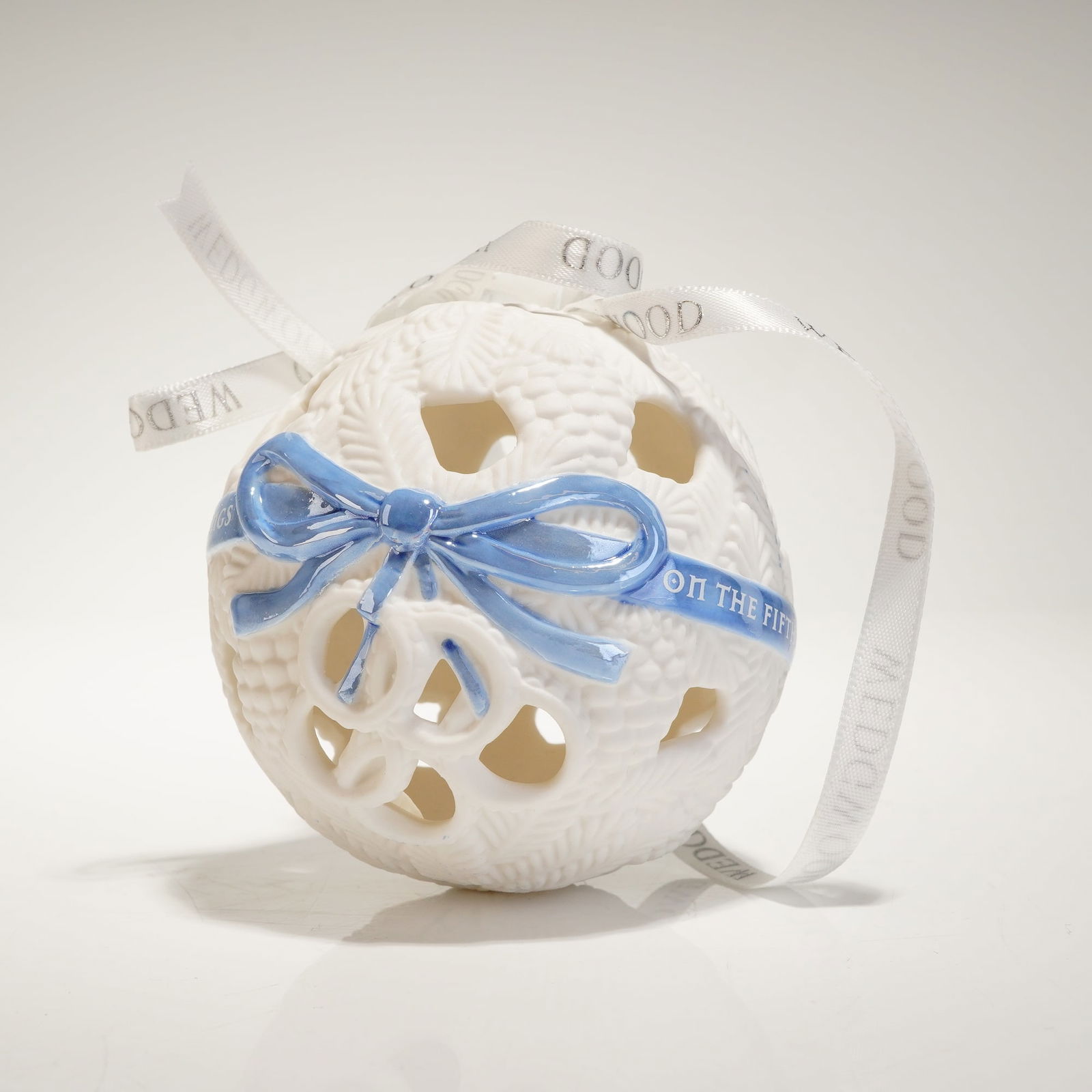 Wedgwood Jasperware 12 Days of Christmas Pierced Ball Ornament: A Wedgwood Jasperware "Twelve Days of Christmas" pierced ball ornament, the 5th Day edition. The spherical ceramic body is executed in white Jasperware and features a reticulated design with molded te