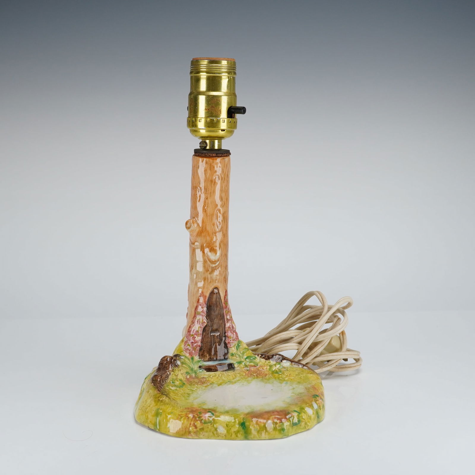 Beswick Beatrix Potter's Tree Lamp Base: Beswick Beatrix Potter Tree Lamp Base designed by Albert Hallam and James Hayward in brown and green coloration, modeled as a tree with an open space intended for placement of a Beswick Beatrix Potter