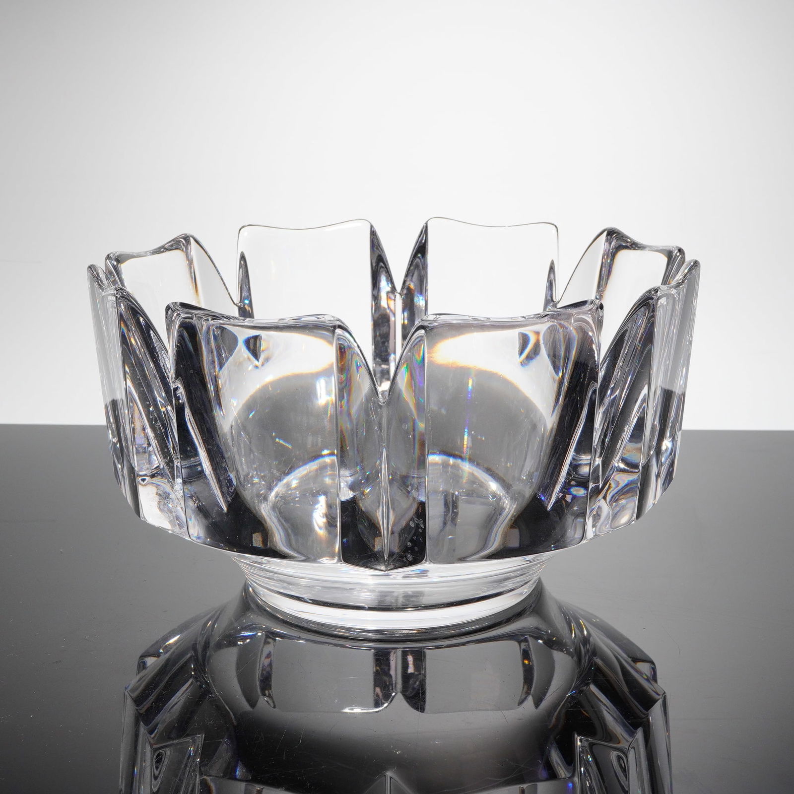 Orrefors Crystal Corona Bowl by Lars Hellsten: A heavy crystal bowl, known as the 'Corona' patern, designed by Lars Hellsten for Orrefors, Sweden. This modernist Orrefors Crystal bowl features thick walls and deep prismatic faceting across the bod