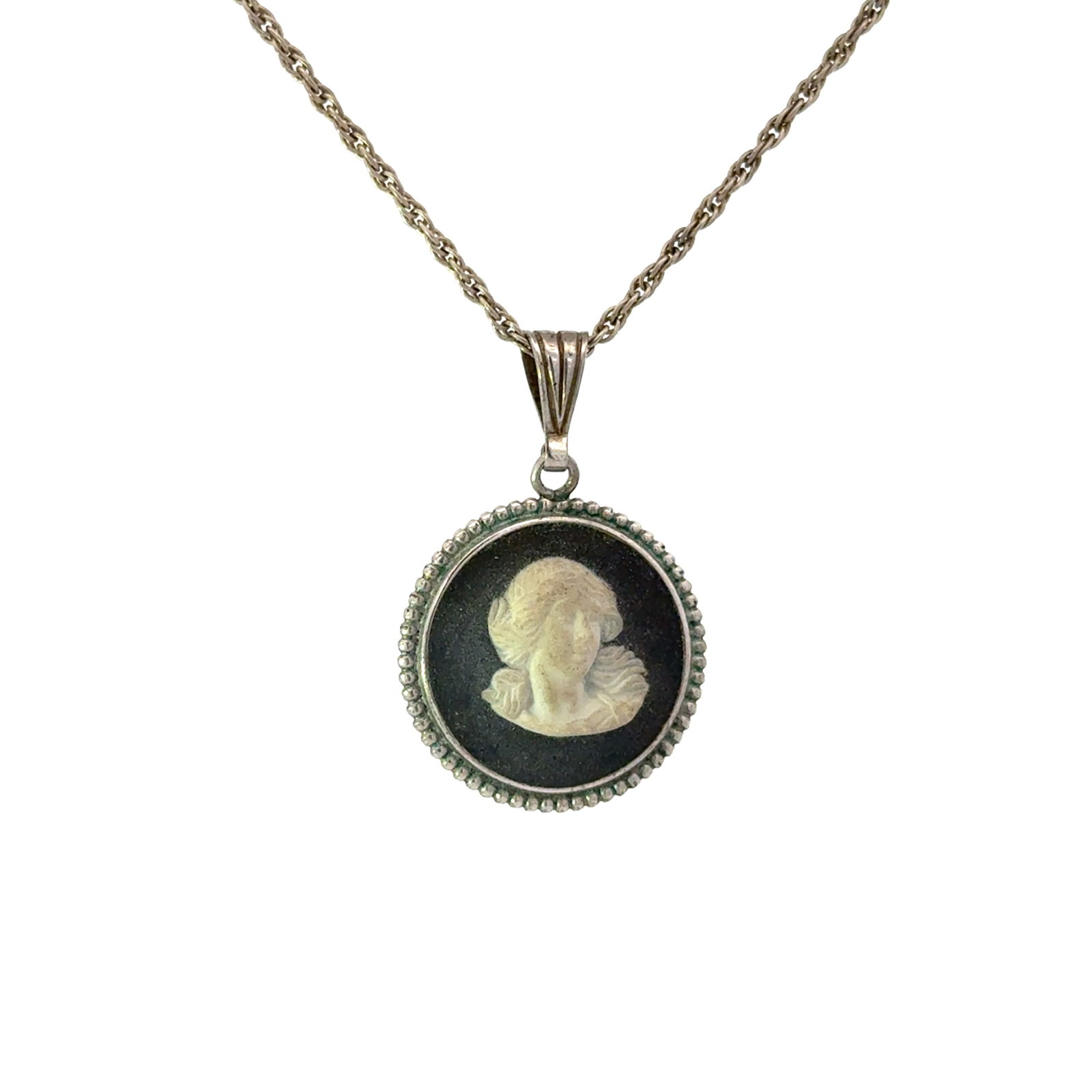 Wedgwood Black Jasperware Sterling Silver Cameo Pendant Necklace: A Wedgwood Jasperware pendant necklace featuring a circular cameo set in a silver bezel. The cameo displays a white classical female bust in relief against a black ground. The pendant setting features