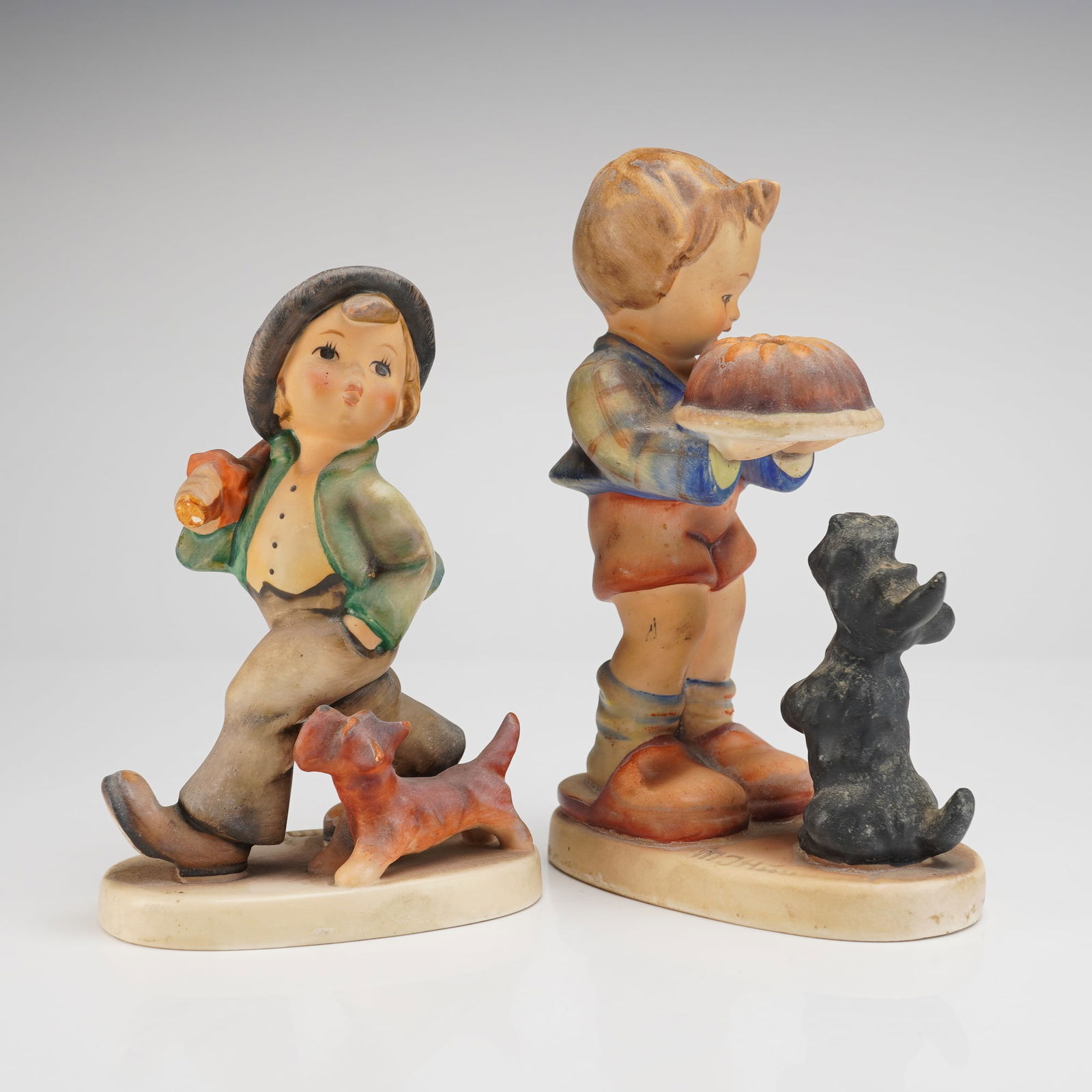 A Pair of Goebel Hummel Figurines Strolling Along and Begging His Share (1 of 3)