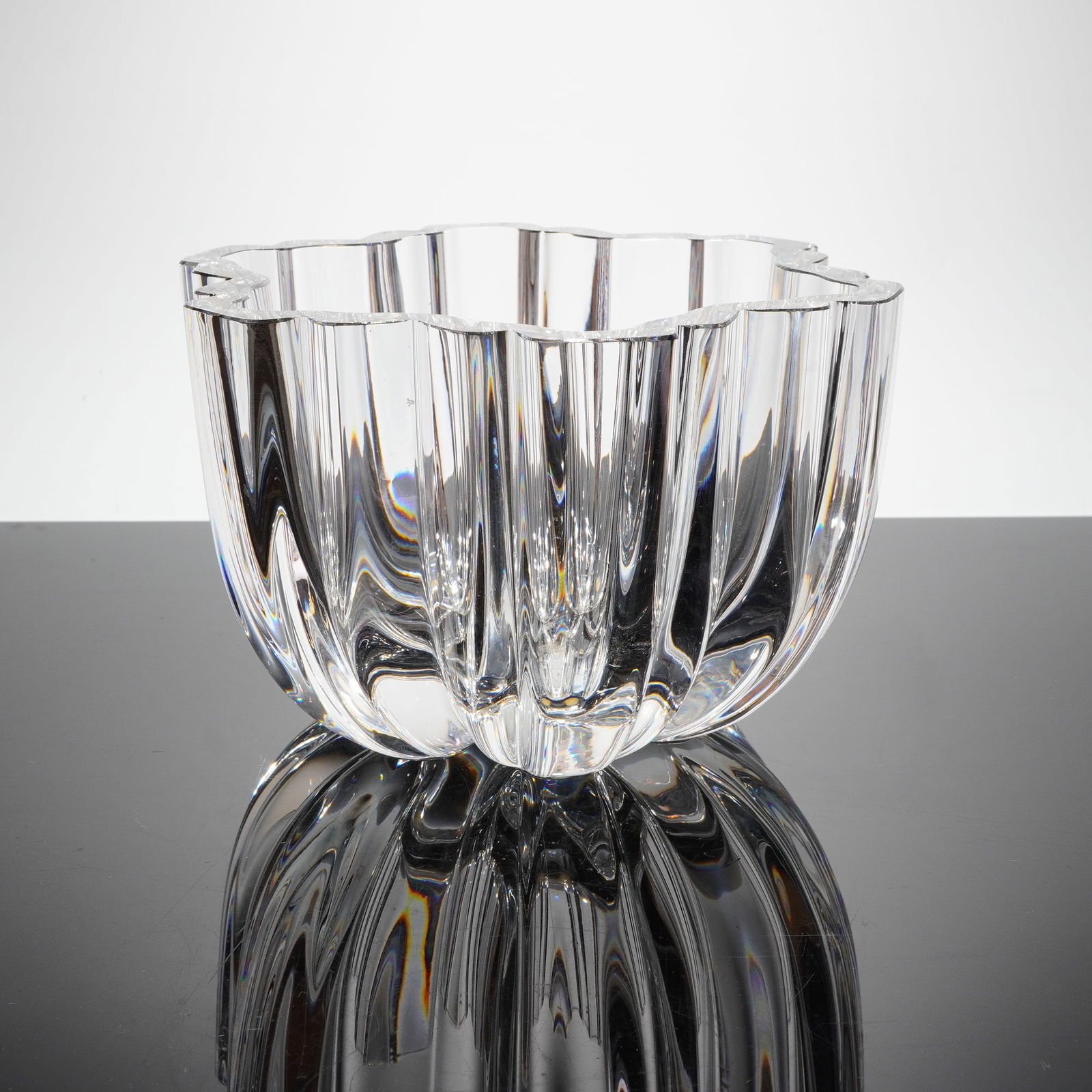 Kosta Boda Crystal Bowl Designed by Anna Ehrner: A single decorative crystal bowl atributed to Kosta Boda, Sweden, and designed by Anna Ehrner. The vessel is executed in clear, heavy cut glass consistent with Scandinavian Mid-Century Modern design.