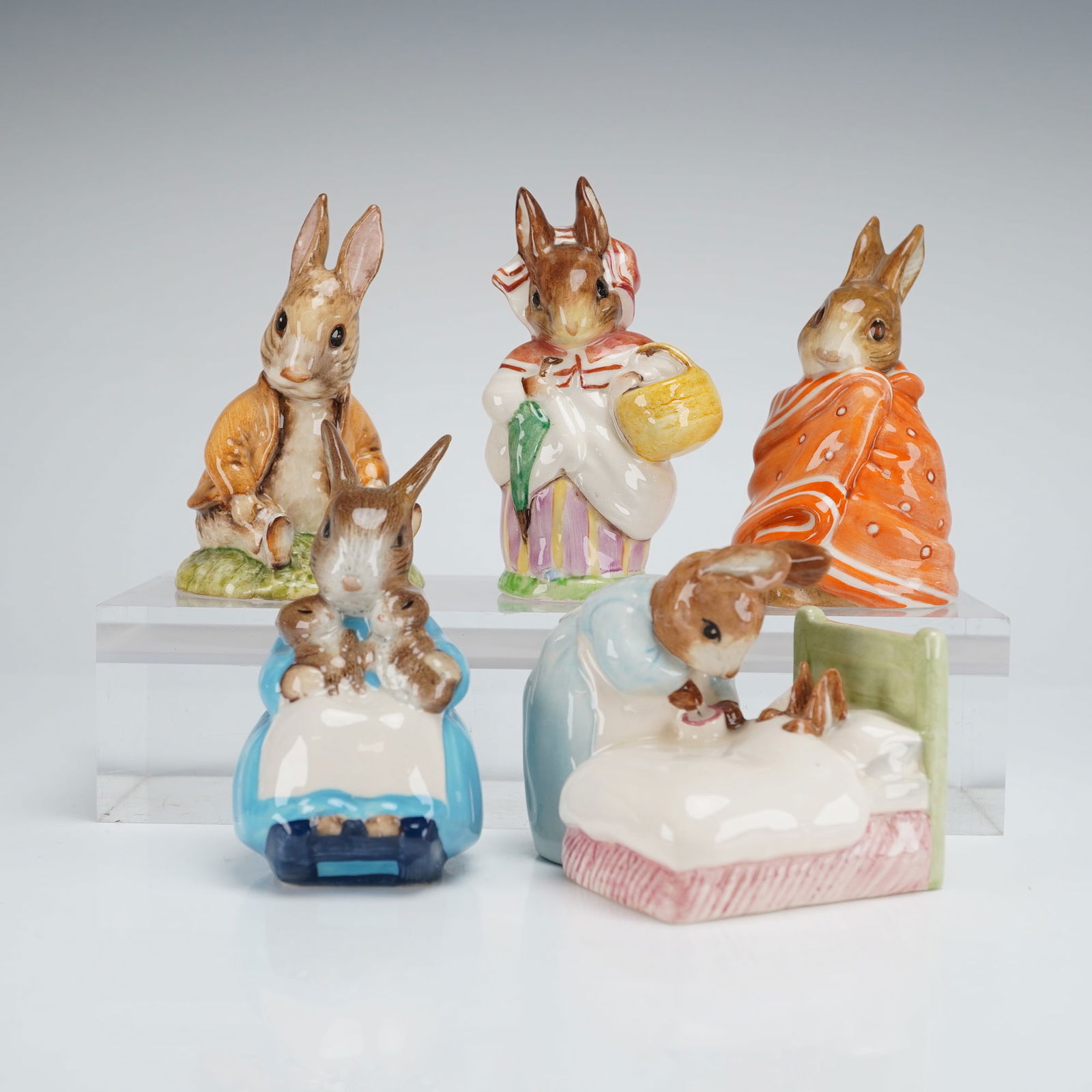 5pc Royal Albert and Beswick Beatrix Potter's Figurines: Collection of five Royal Albert and Beswick Beatrix Potter figurines. Includes two Royal Albert pieces, both signed by Michael Doulton: Peter in Bed (3473) and Mrs. Rabbit and Bunnies (2543). The set
