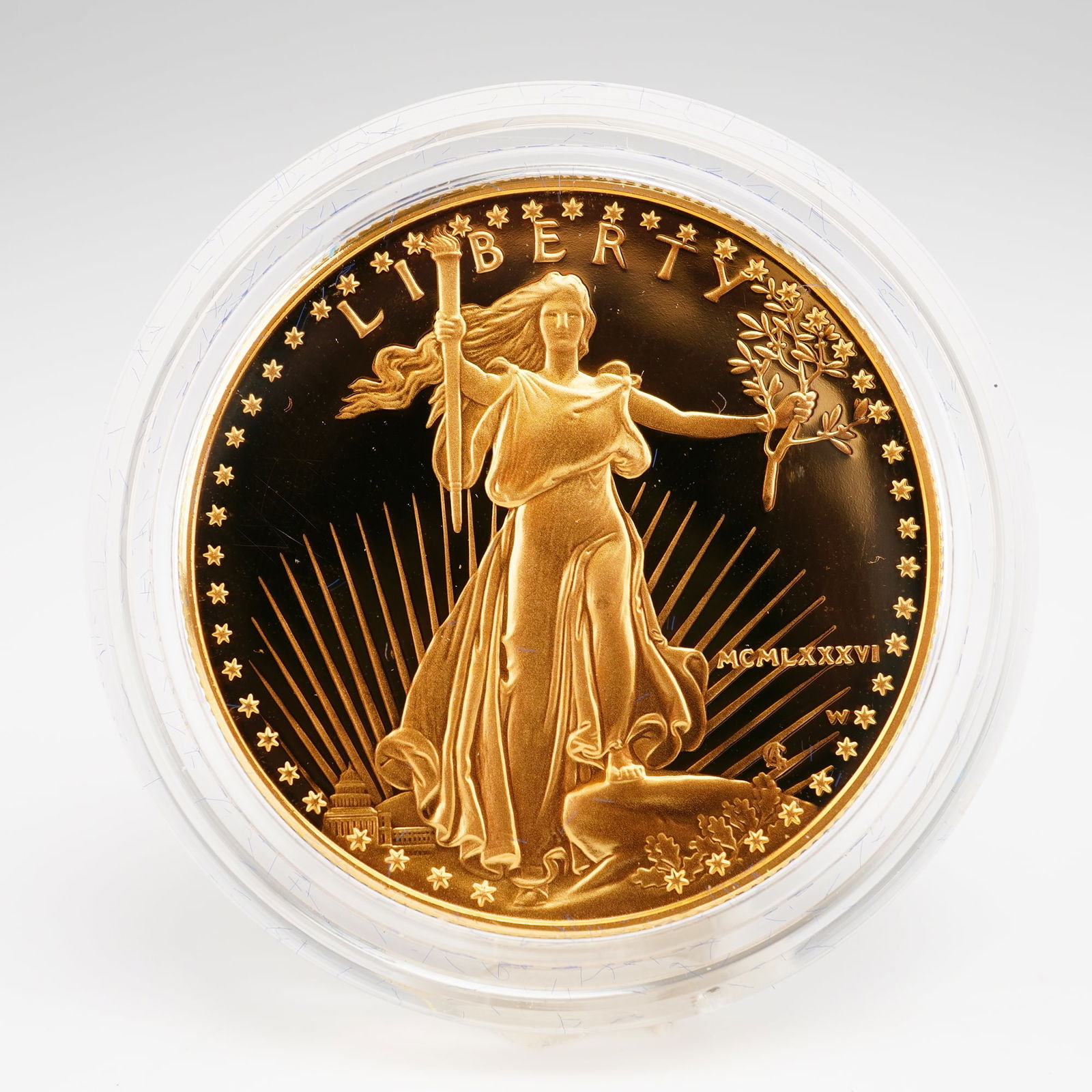 1986 US $50 American Gold Eagle 1 oz. Bullion Coin OGP: Minted at the West Point Mint. The obverse features the iconic effigy of Liberty with the date in Roman numerals (MCMLXXXVI) to the right, designed by Augustus Saint-Gaudens, while the reverse shows a