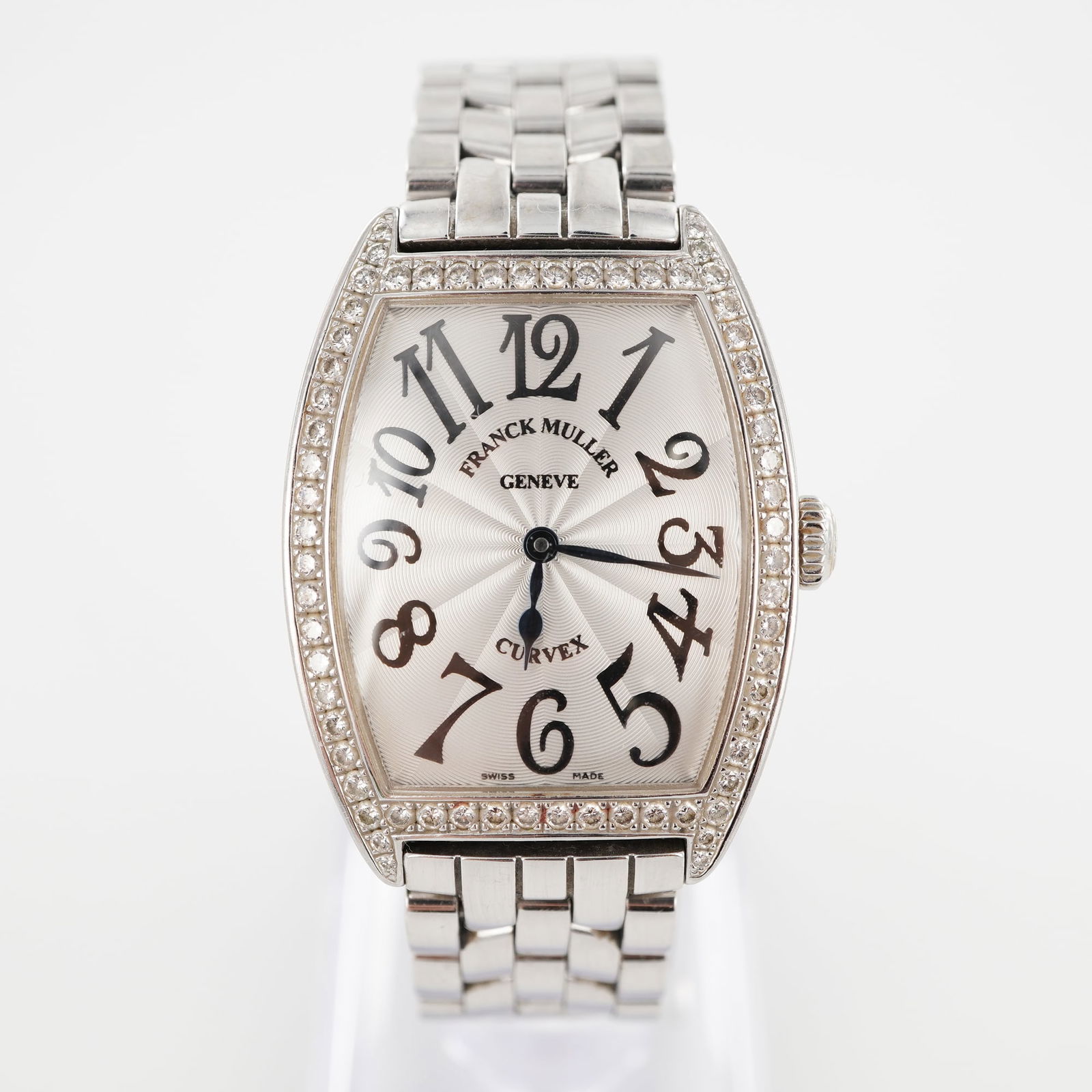 Franck Muller Cintree Curvex Diamond Bezel Ladies Watch: Stainless steel case with curved sapphire crystal and silvered sunray-pattern dial featuring hand-painted stylized numerals and blued steel hands. Bezel set with 68 brilliant-cut diamonds. Swiss quart