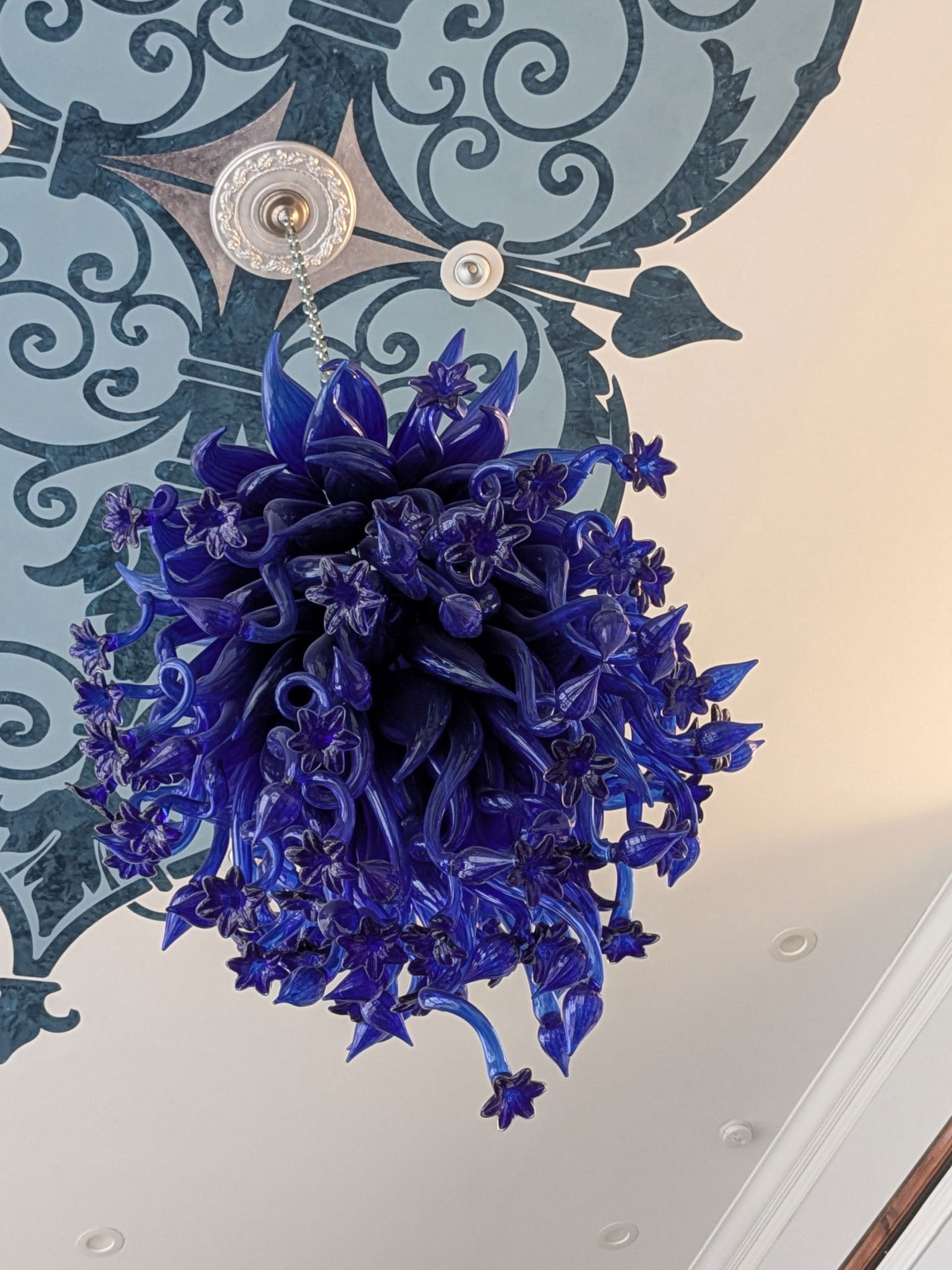 Monumental Cobalt Blue Art Glass Chandelier Botanical Form, Chihuly-Style: Commanding in scale and breathtaking in presence, this monumental hand-blown art glass chandelier measures approximately 4.5 feet in height and is designed to be the undeniable focal point of any spac