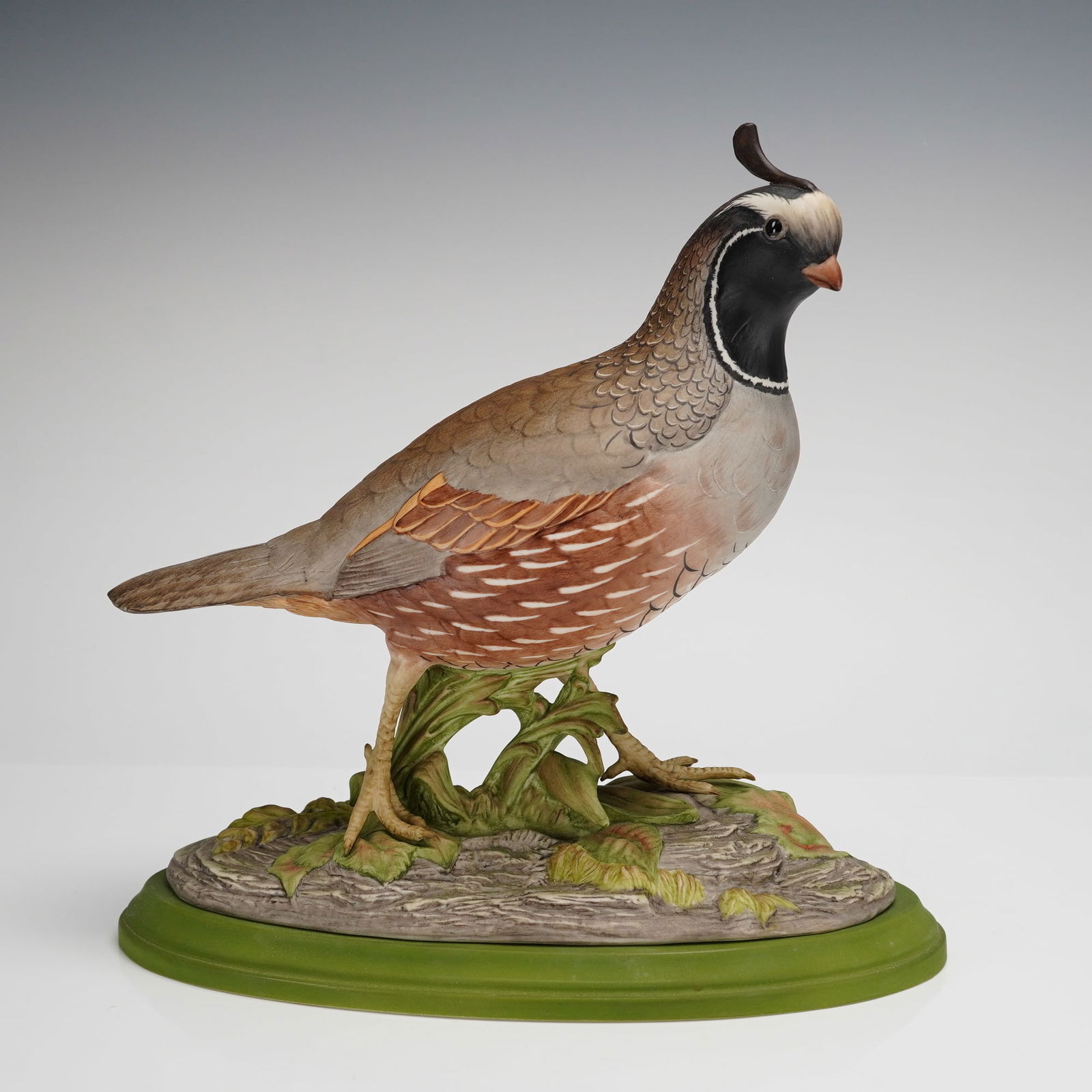 Boehm Porcelain Figurine, California Quail 433: A finely detailed Boehm porcelain figurine depicting a California quail, model 433, presented on a green porcelain base. The bird is shown in naturalistic form with careful attention to feather patter