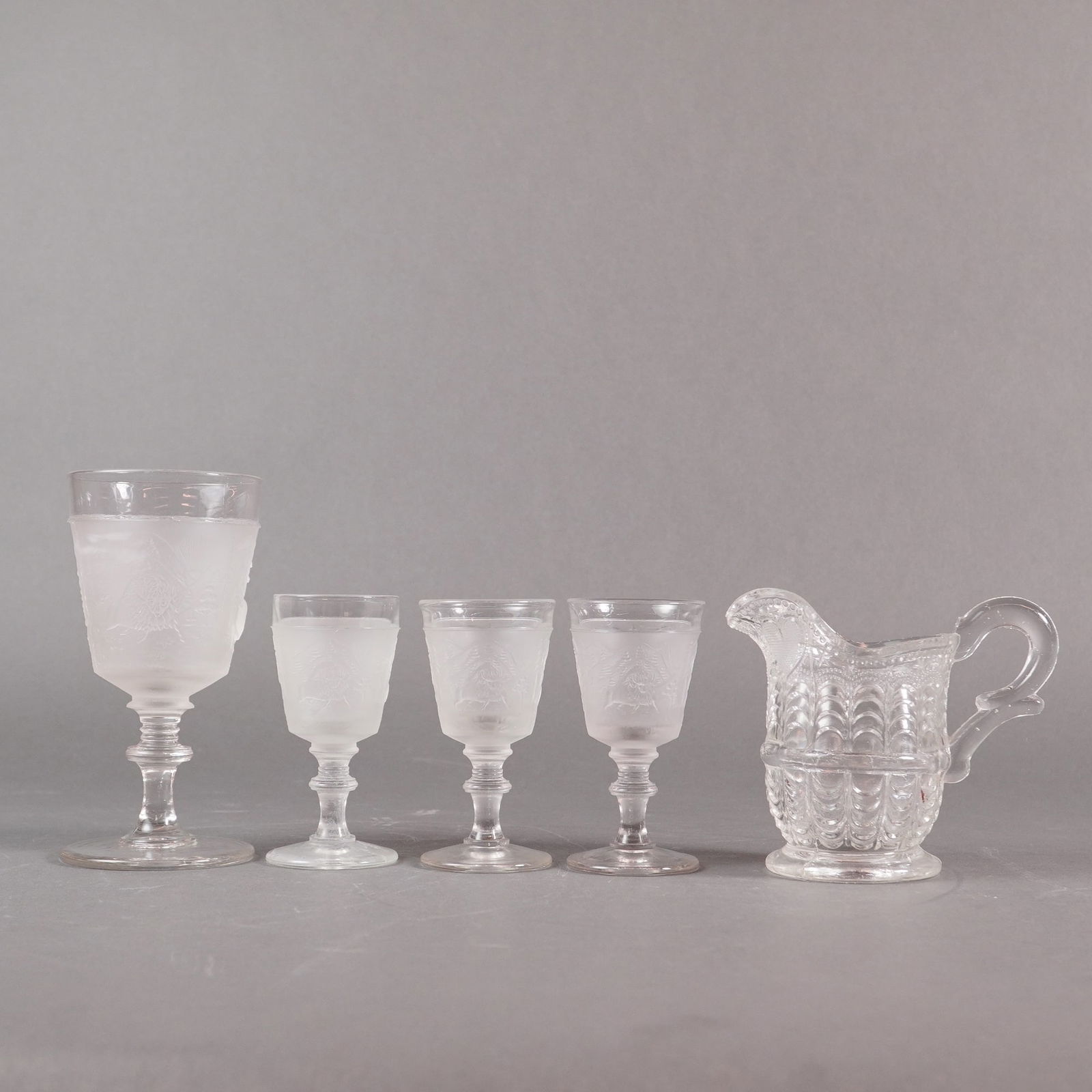 A Collection of 5 EAPG Pressed Glass Cups and Pitcher (1 of 3)