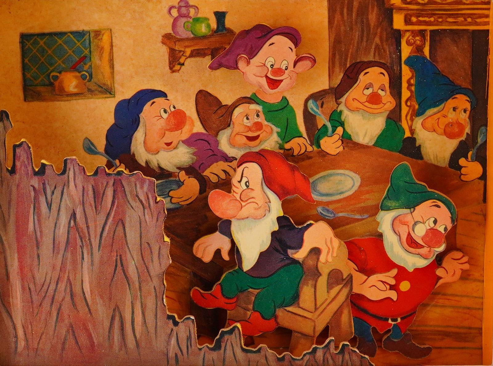 Walt Disney Snow White and the Seven Dwarfs Diorama Shadow Box Art: A vintage Walt Disney Snow white & the seven dwarves diorama or shadow box artwork. The piece depicts a scene featuring the seven individually cut and painted figures of the dwarves gathered around a