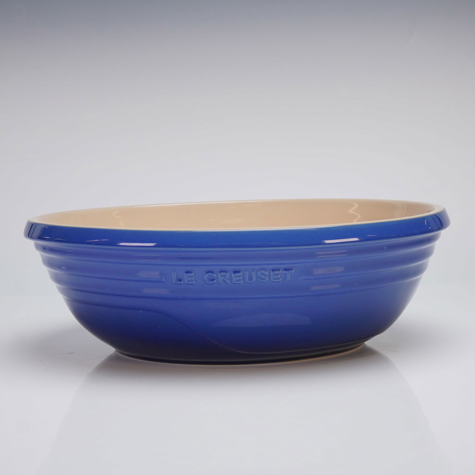 Le Creuset Oval Serving Bowl 3.6Qt., Cobalt Blue: This elegant oval bowl is crafted from Le Creusets renowned enameled cast iron and finished in a rich cobalt blue glaze. The durable enamel surface ensures even heat distribution and excellent heat re