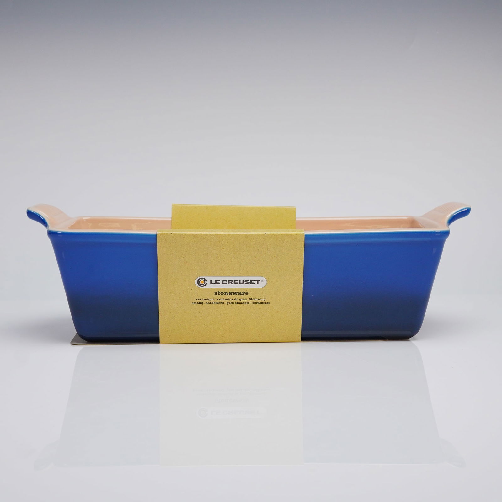 Le Creuset Stoneware 2Qt. Rectangular Loaf Dish in Cobalt Blue: A single Le Creuset stoneware baking vessel, identified through web consensus as the Heritage Loaf Dish. The rectangular pan is constructed of durable stoneware and features an enameled finish. The ex